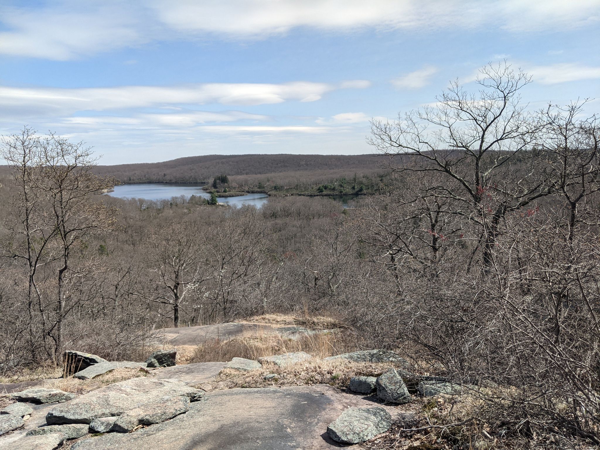 Panoramic view of a lake surrounded by bare winter trees under a bright sky. - Panther Mountain, Diamond Mountain and Pine Meadow Lake Loop