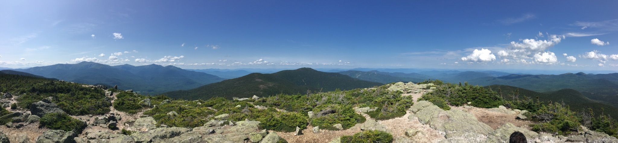 Panoramic view of rocky mountain peaks under a bright blue sky. - Mount Hight to Carter Dome to North Carter Loop