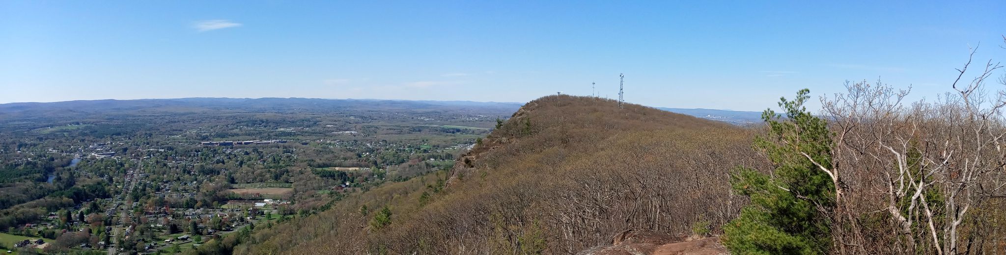 Panoramic view of a forested mountain ridge with towers and a wide valley. - Mt Tom via NET, T. Bagg, Reservation Rd, Bray, and Mt Tom Ski Rd Loop