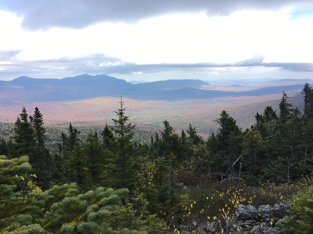 Vast mountain landscape with autumn-colored valley under an overcast sky. - Mount Redington via Appalachian Trail