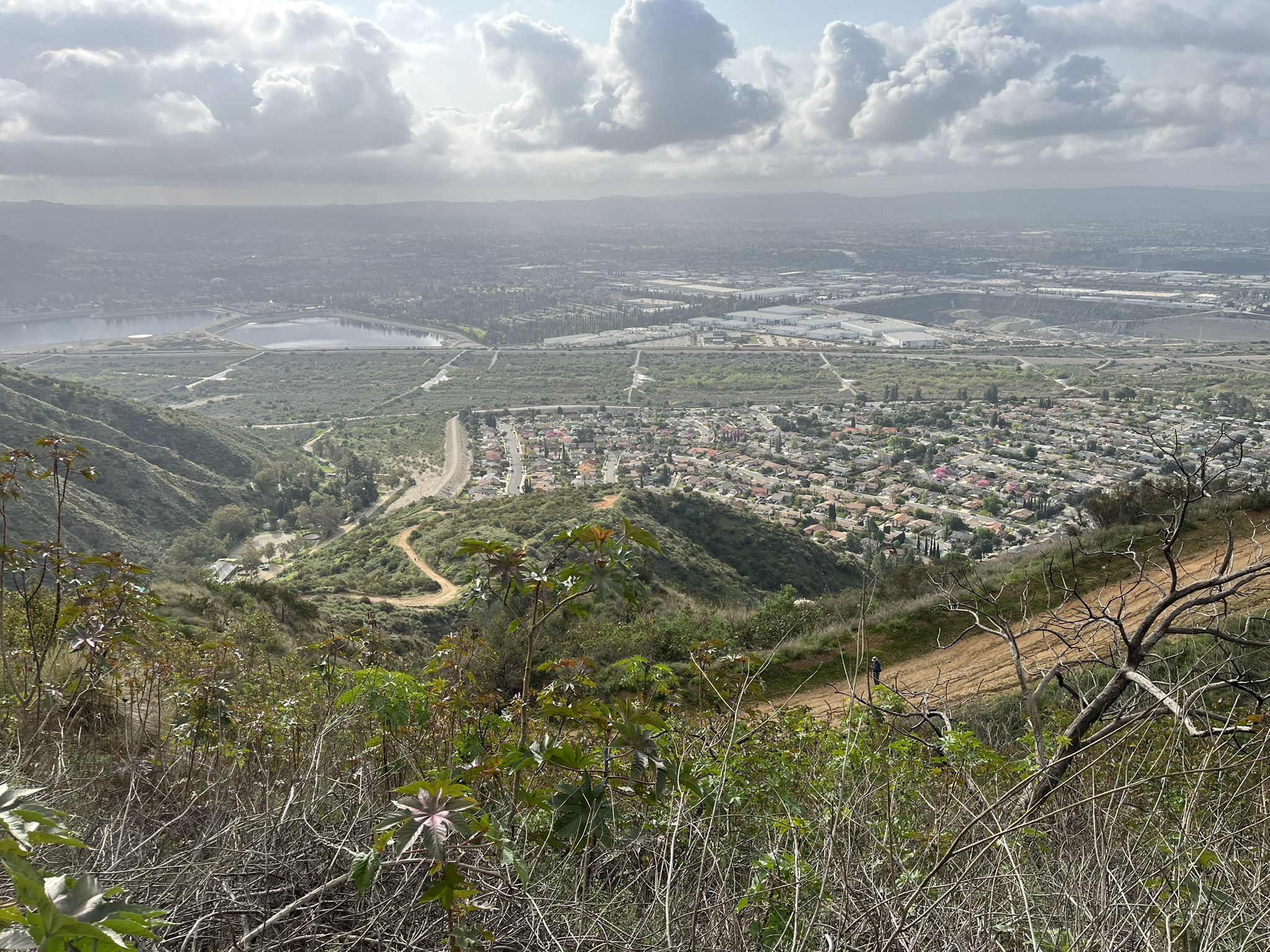 Panoramic view of a valley with a town and reservoirs under cloudy sky. - Mount Bliss loop from Irwindale
