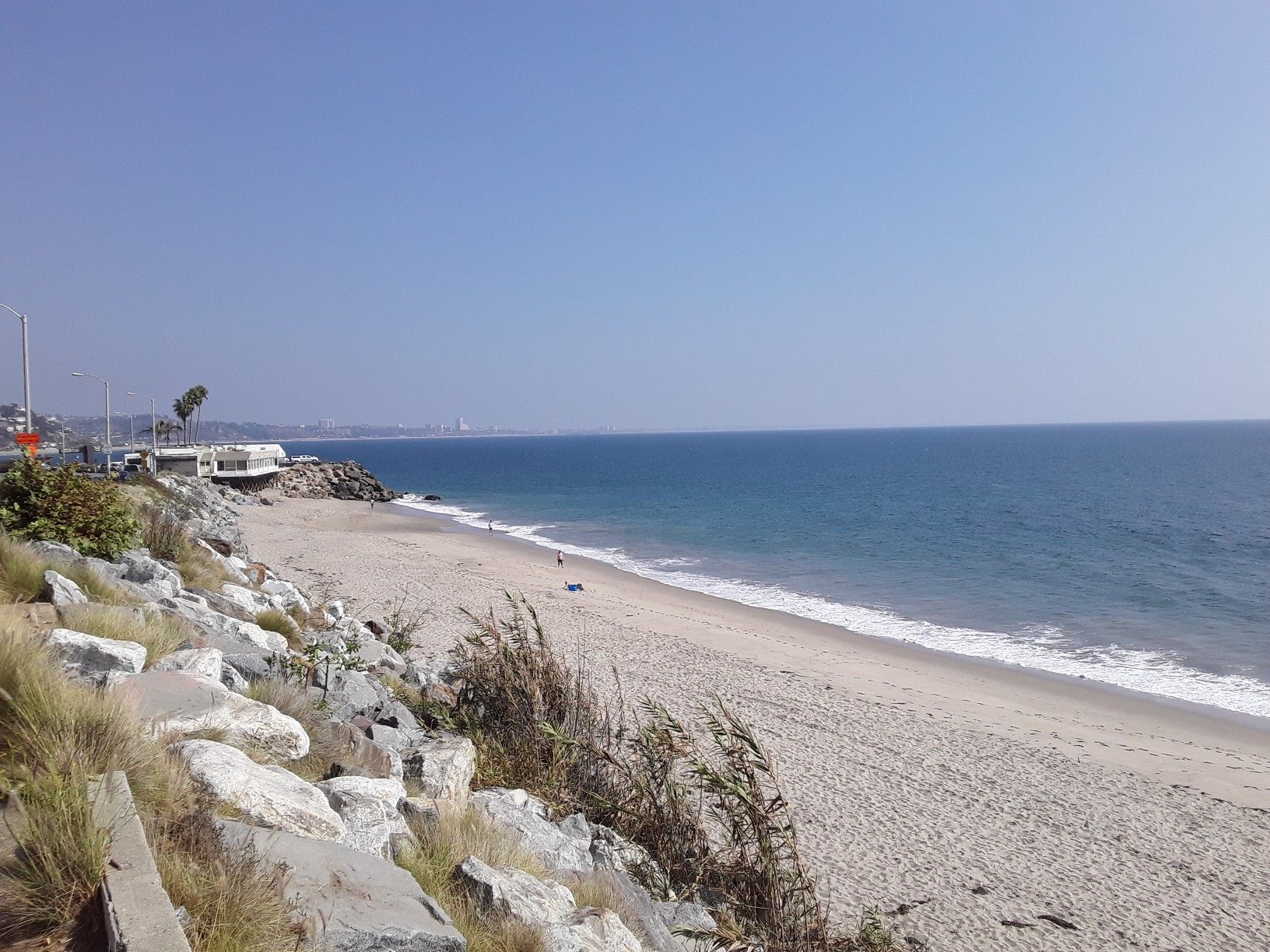 Wide sandy beach next to a calm blue ocean on a clear, bright day. - Malibu Canyon Loop