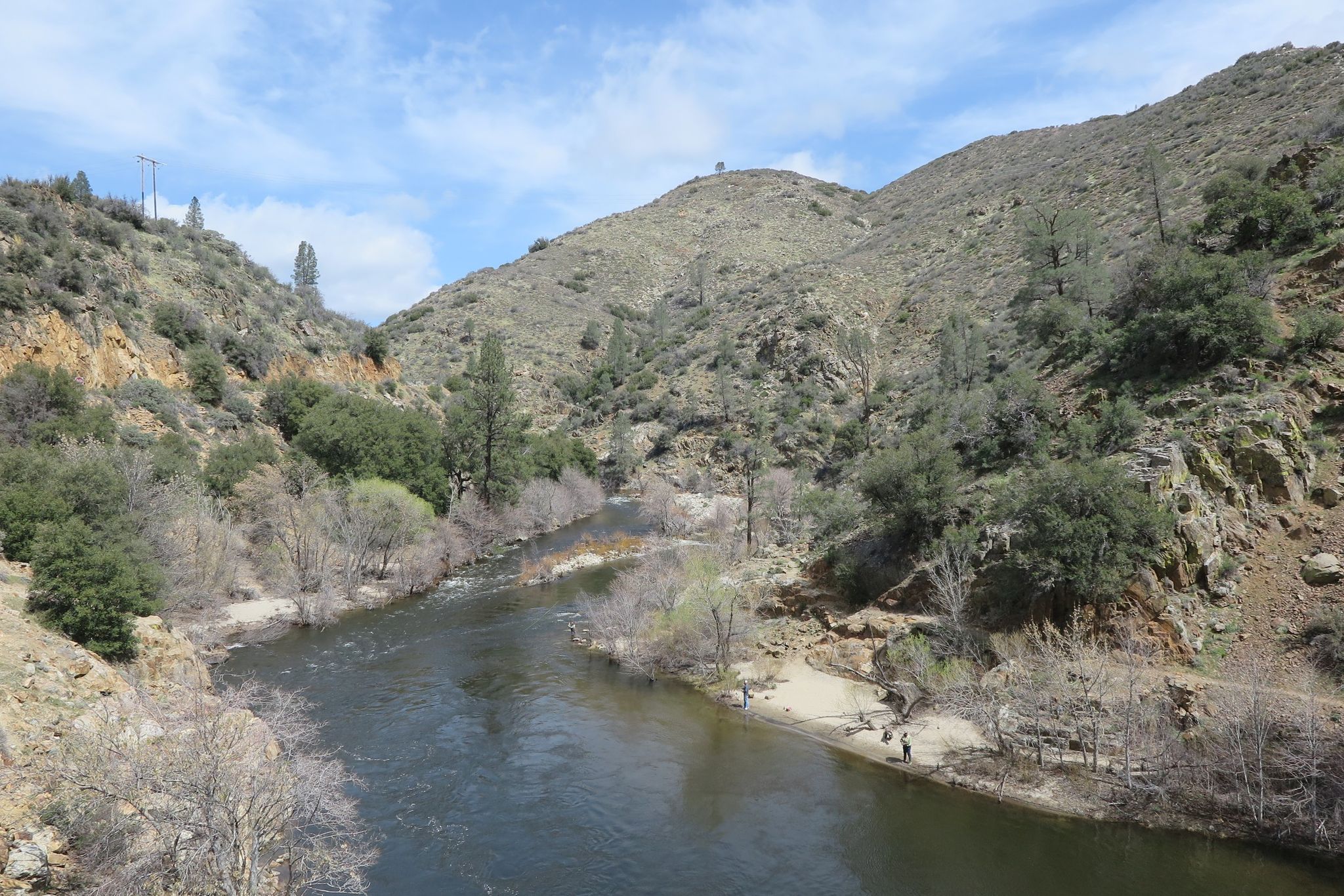 River winding through a canyon, two people on the far bank, bright day. - Kern River Upper Trail