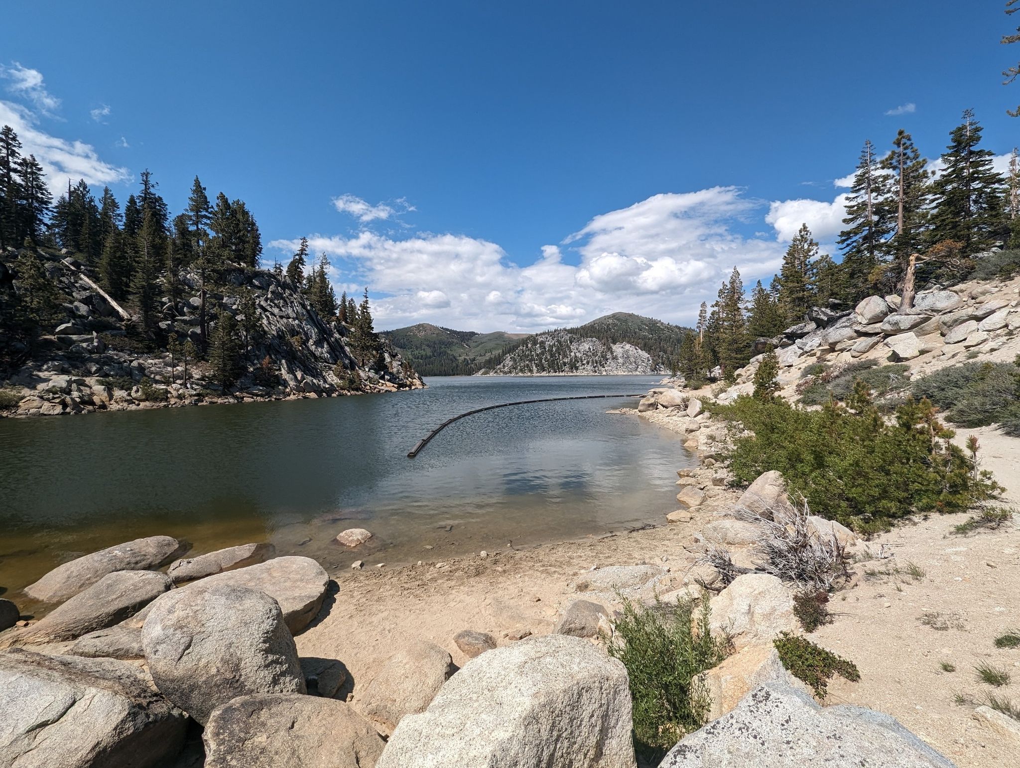 Sunny day over a clear lake with rocky shores and forested mountains. - Marlette Lake – Marlette Flume Trail loop from Glenbrook