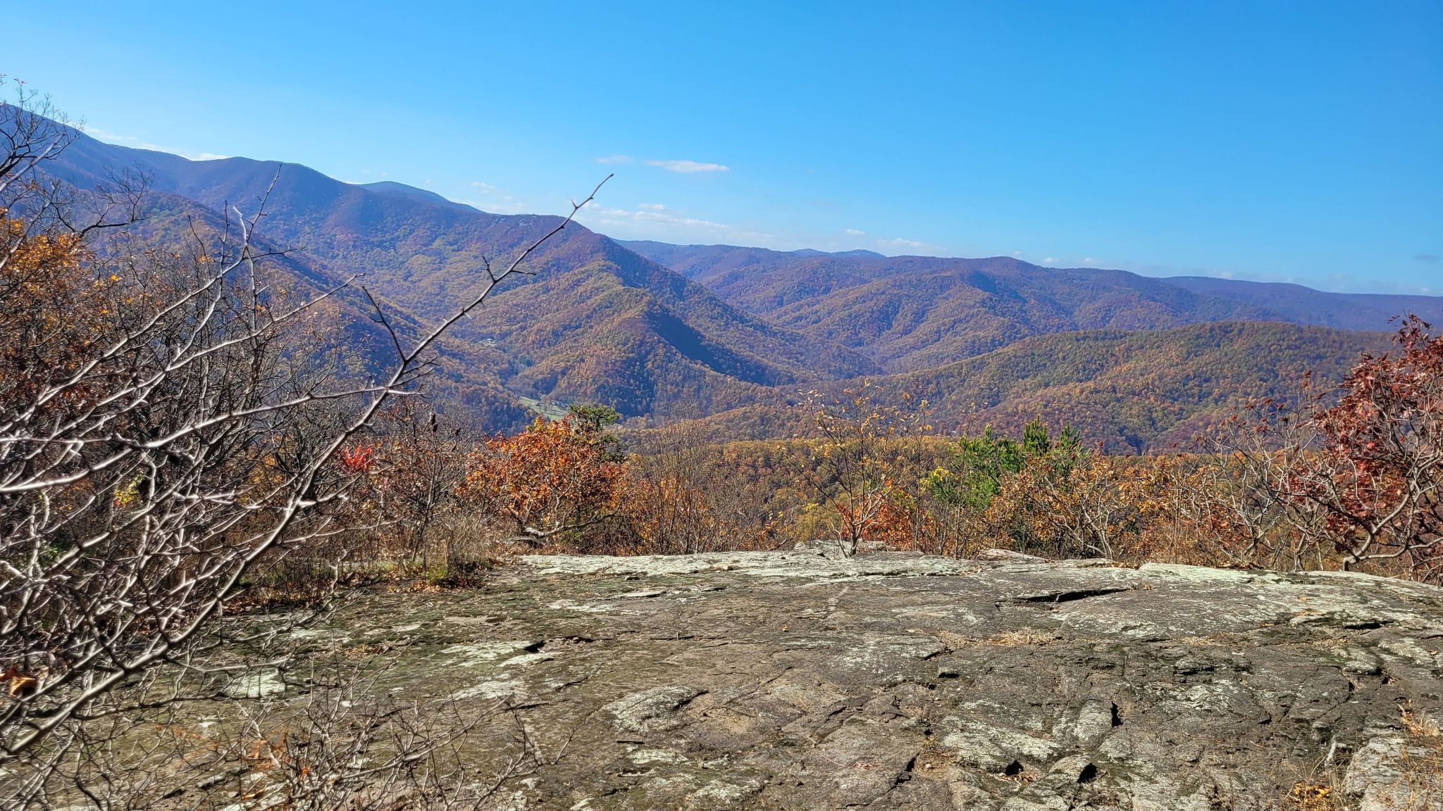 Sunny autumn mountain vista from a rocky overlook, with a clear blue sky. - Appalachian Trail: Reeds Gap to Tye River