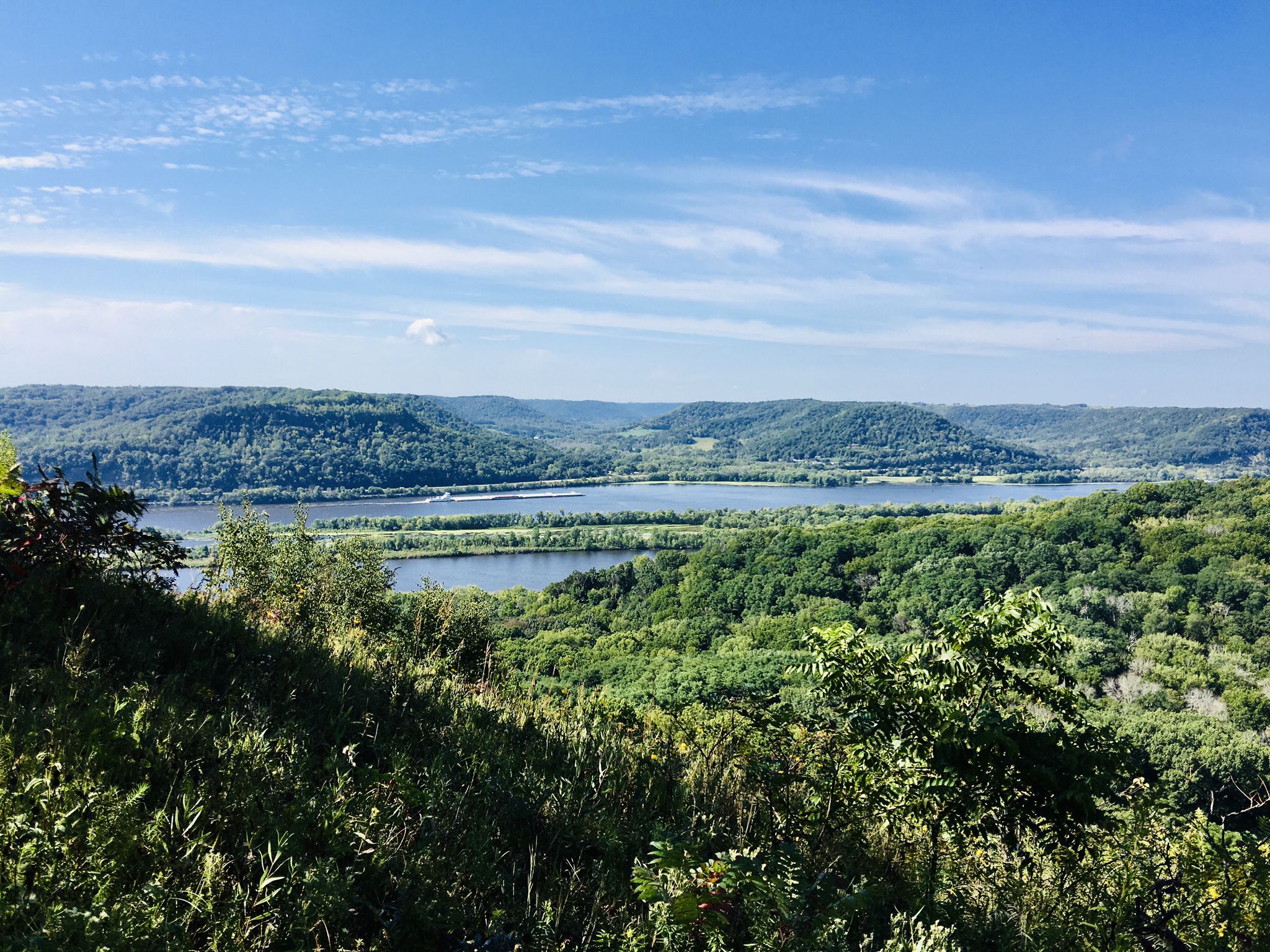 Expansive view of a wide river flowing through forested hills on a sunny day. - Perrot Ridge – Reed's Peak loop from Perrot State Park