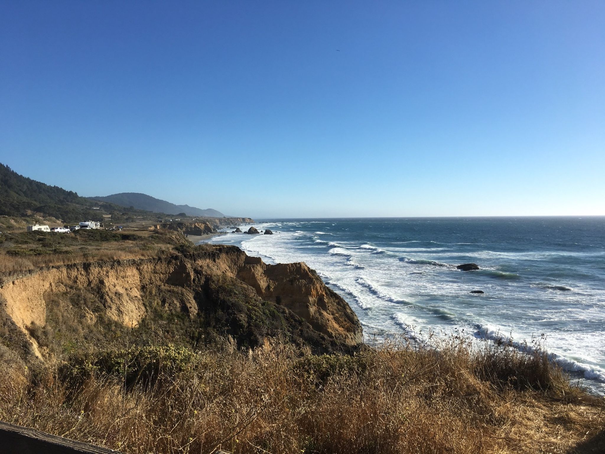 Coastal cliffs overlooking ocean waves under a clear blue sky. - Leggett to Westport via California State Route 1