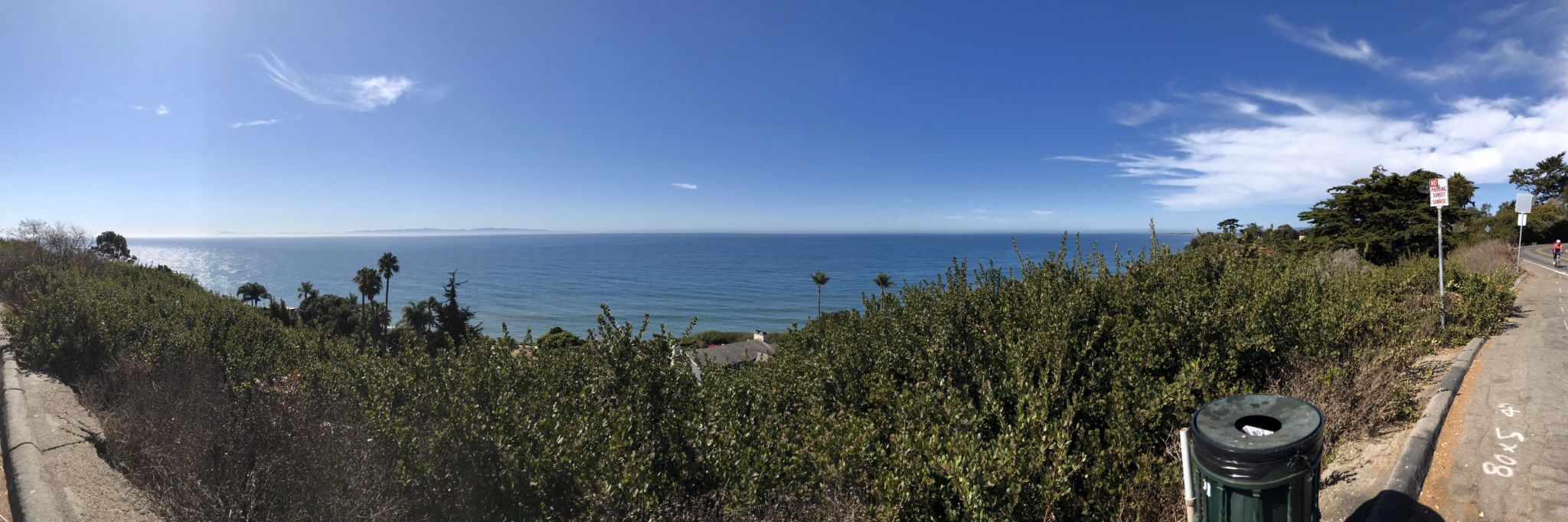 Panoramic view of a vast blue ocean from a green coastal bluff. - Elings Park – Modoc Multi Use Trail loop from San Marcos High School