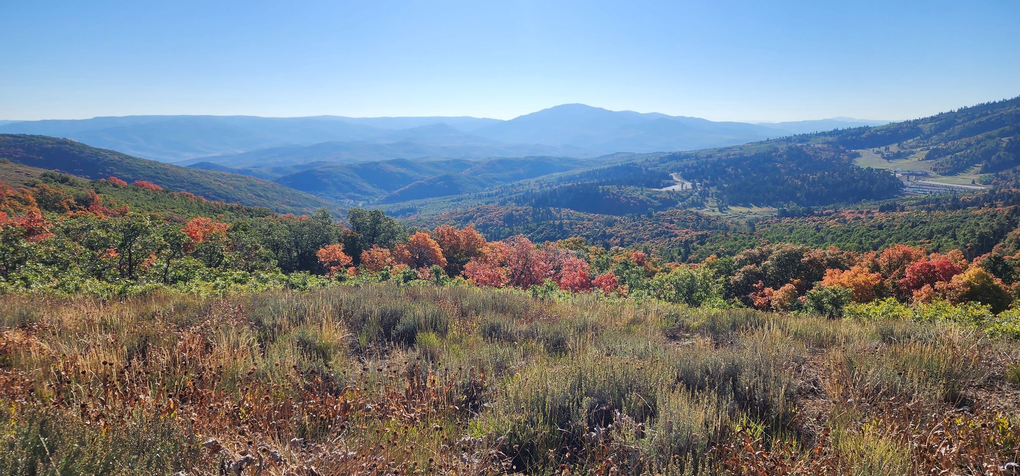 Panoramic mountain vista with vibrant autumn trees and distant peaks under clear sky. - Green Pond – Wheeler Creek Trail loop from Pineview Dam