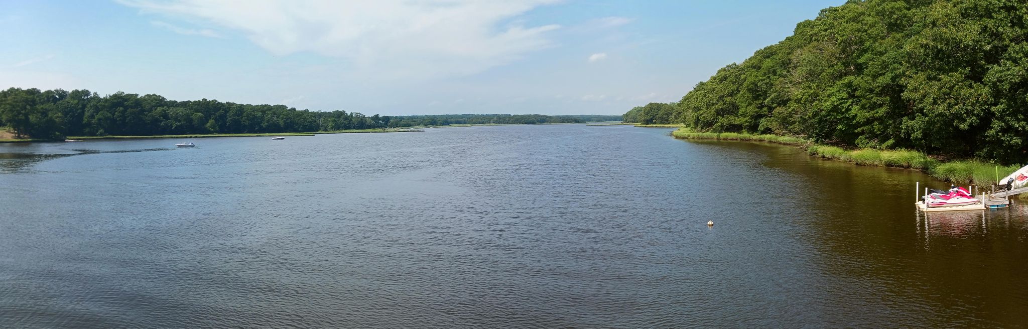 Panoramic view of a wide river with dense green forests on both banks. - East Horseneck Beach – Horseneck Beach loop from Bar Rock