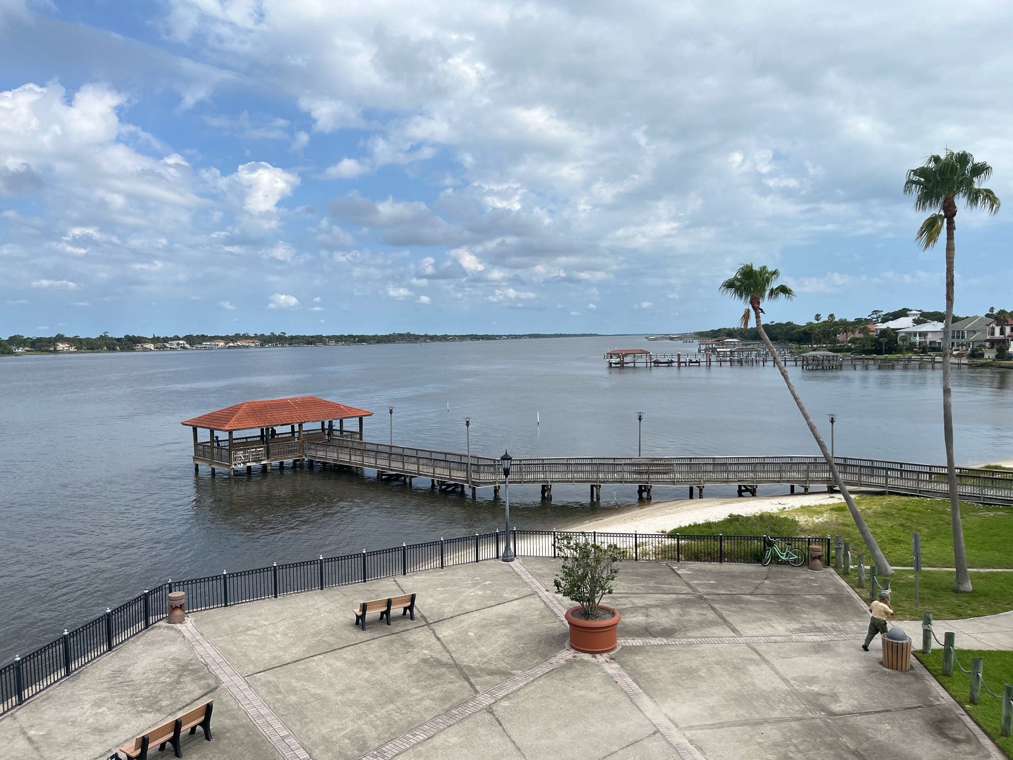 An elevated view of a long pier with a covered gazebo extending over water. - East Coast Greenway: Daytona Beach Loop