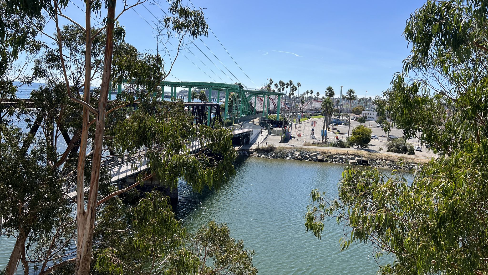 Green truss bridge over calm water, framed by trees, under a bright sky. - Bonny Doon & California Coastal National Monument loop from Santa Cruz