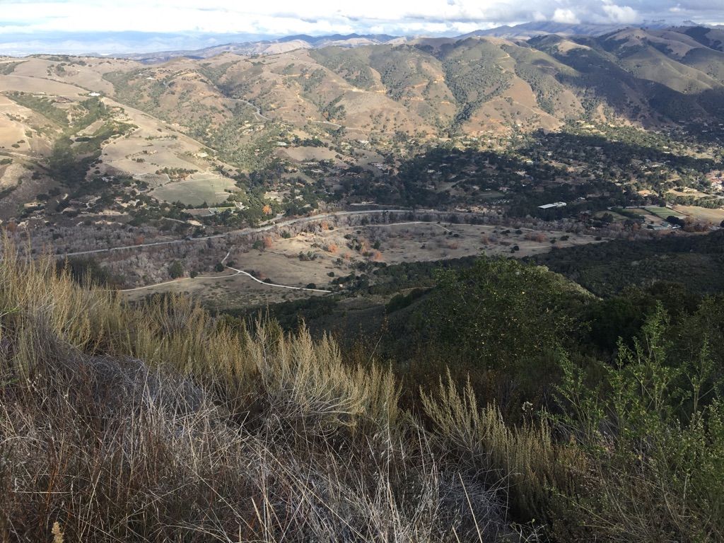 Panoramic view of rolling hills and a valley under a partly cloudy sky. - Snively's Ridge Trail loop from Carmel Valley Ranch Golf Course