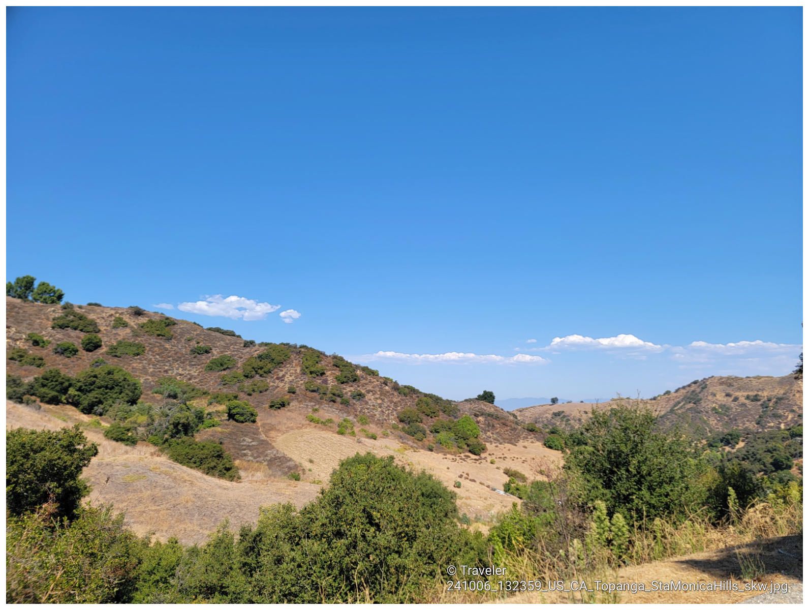 Arid, rolling hills covered in sparse vegetation under a clear blue sky. - Topanga – Wild Walnut Park loop from El Escorpion Park