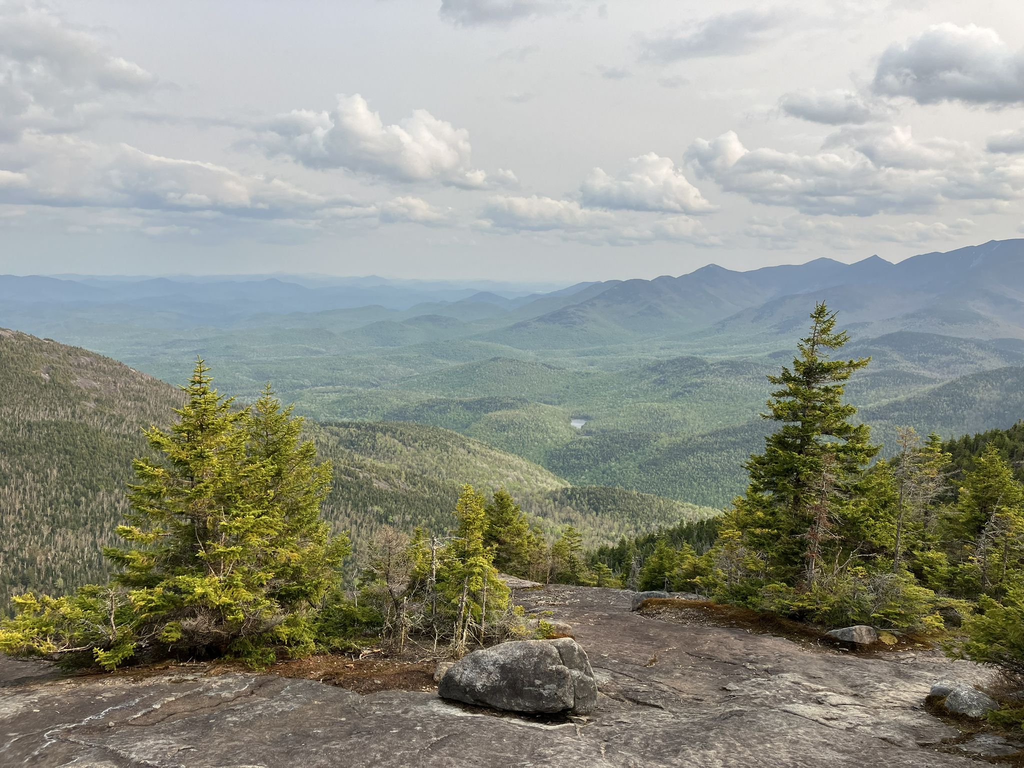 Vast mountain landscape with green valleys, evergreen trees, and cloudy sky. - Ridge Trail to Giant Mountain and Rocky Peak Ridge