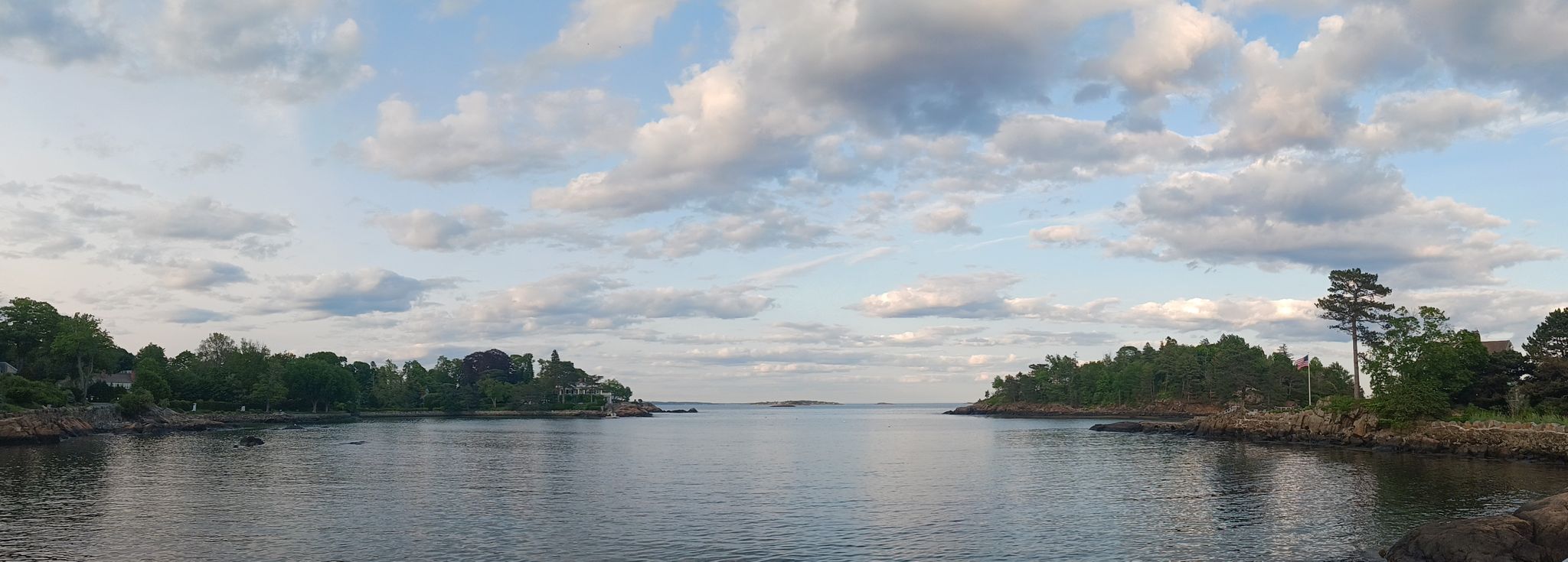 Calm bay between two forested landmasses under a cloudy sky. - Fort Sewall – Grace Oliver Beach loop from Marblehead