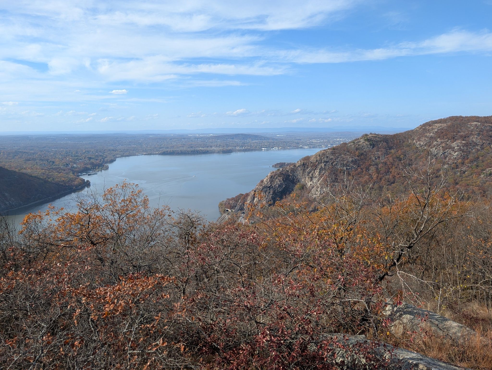 Autumn view of a wide river, rocky hills, and barren trees under a clear sky. - Bull Hill Short Loop