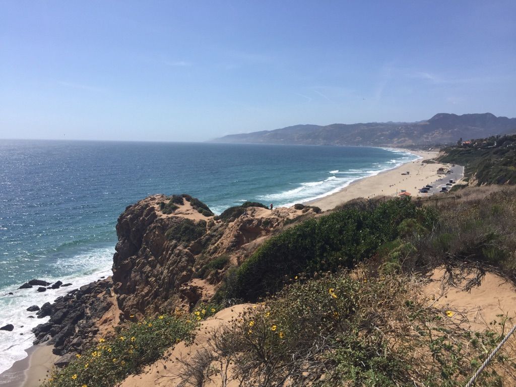 High angle view of a long sandy beach, ocean, and rocky headland. - Point Dume Overlook loop from Malibu Riviera