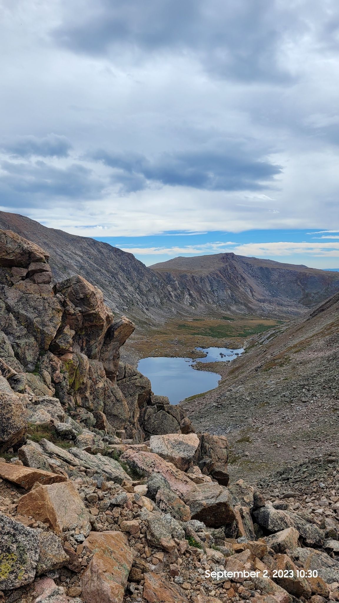 Rocky mountain valley with two lakes under a cloudy sky. - Mount Bierstadt and The Sawtooth Loop