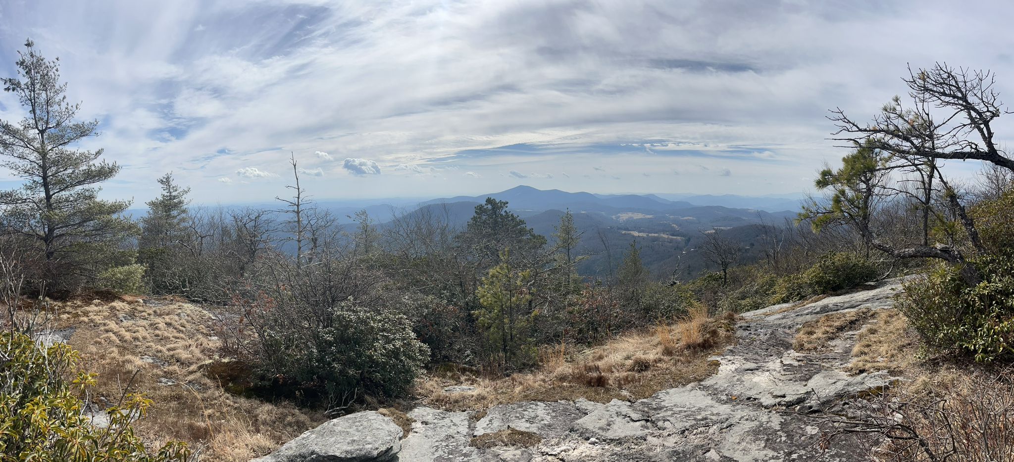 Panoramic view of a vast mountain landscape under a cloudy sky. - Scaly Mountain via Bartram Trail