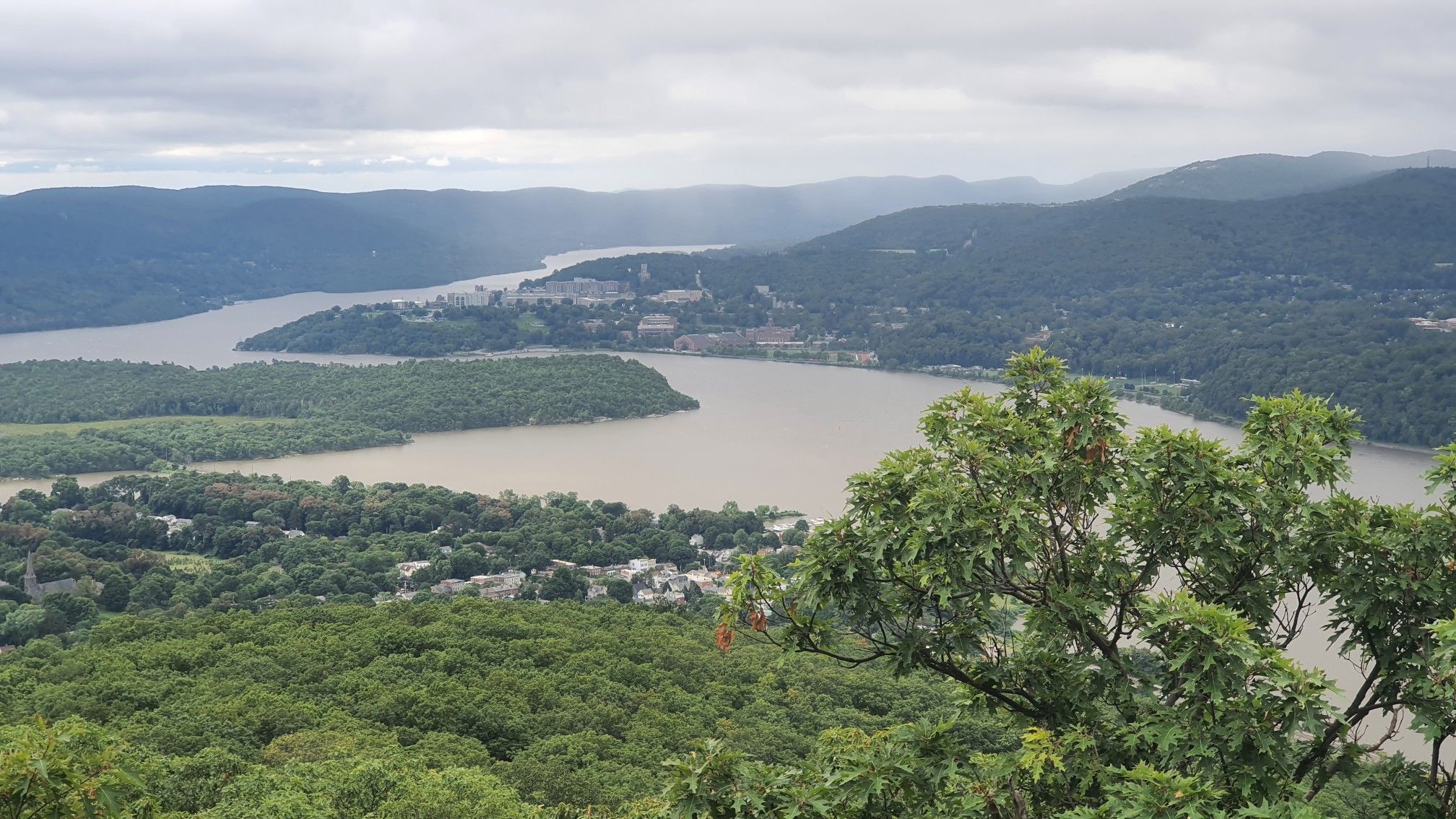Overcast view of a wide river winding through forested hills. - Bull Hill via Undercliff and Washburn Trails