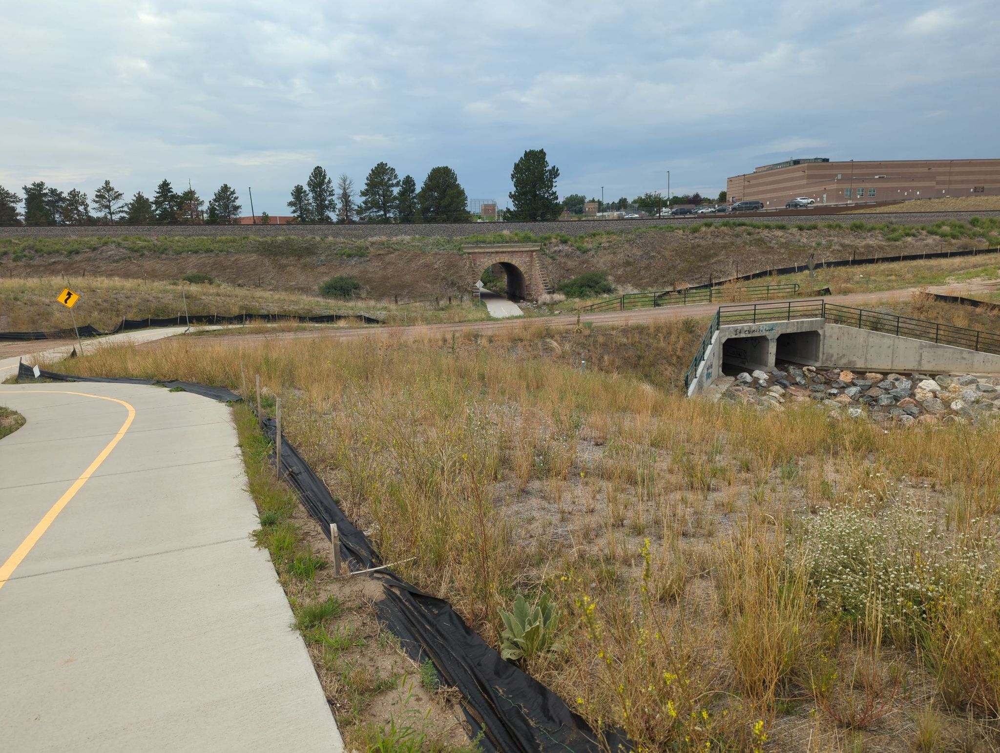Paved path, tunnel, and culvert underpass in dry, grassy landscape. - East Plum Street Creek Trail – East Plum Creek Trail loop from Castle Rock Fire Station 152