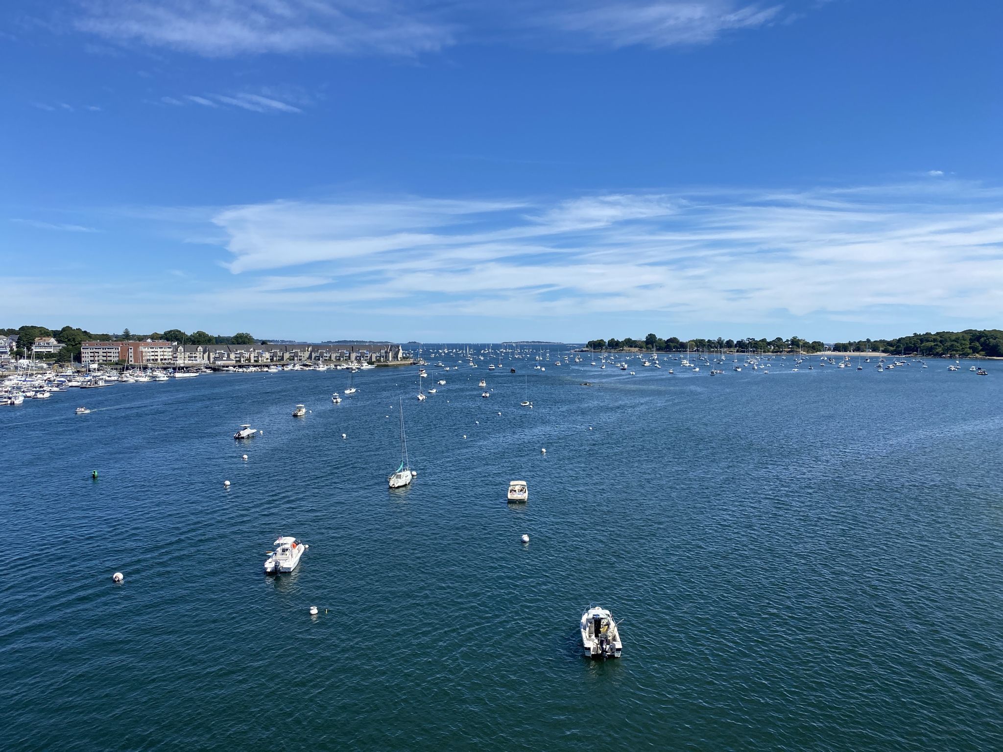 Expansive harbor filled with numerous boats under a bright blue sky. - Salem Witch Museum – Salem Witch Trials Memorial loop from Salem