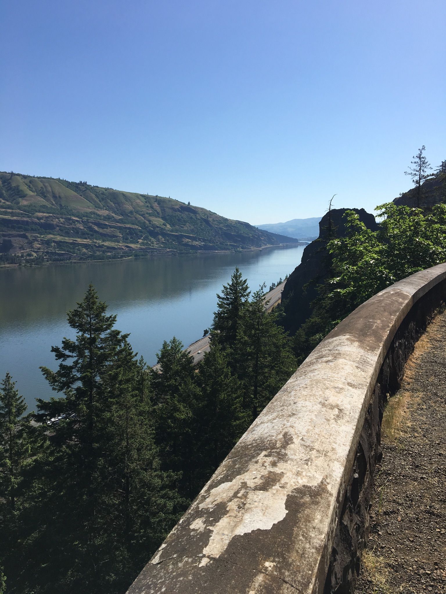 River view from a paved path with a stone barrier, sunny day. - Historic Columbia River Highway State Trail Loop