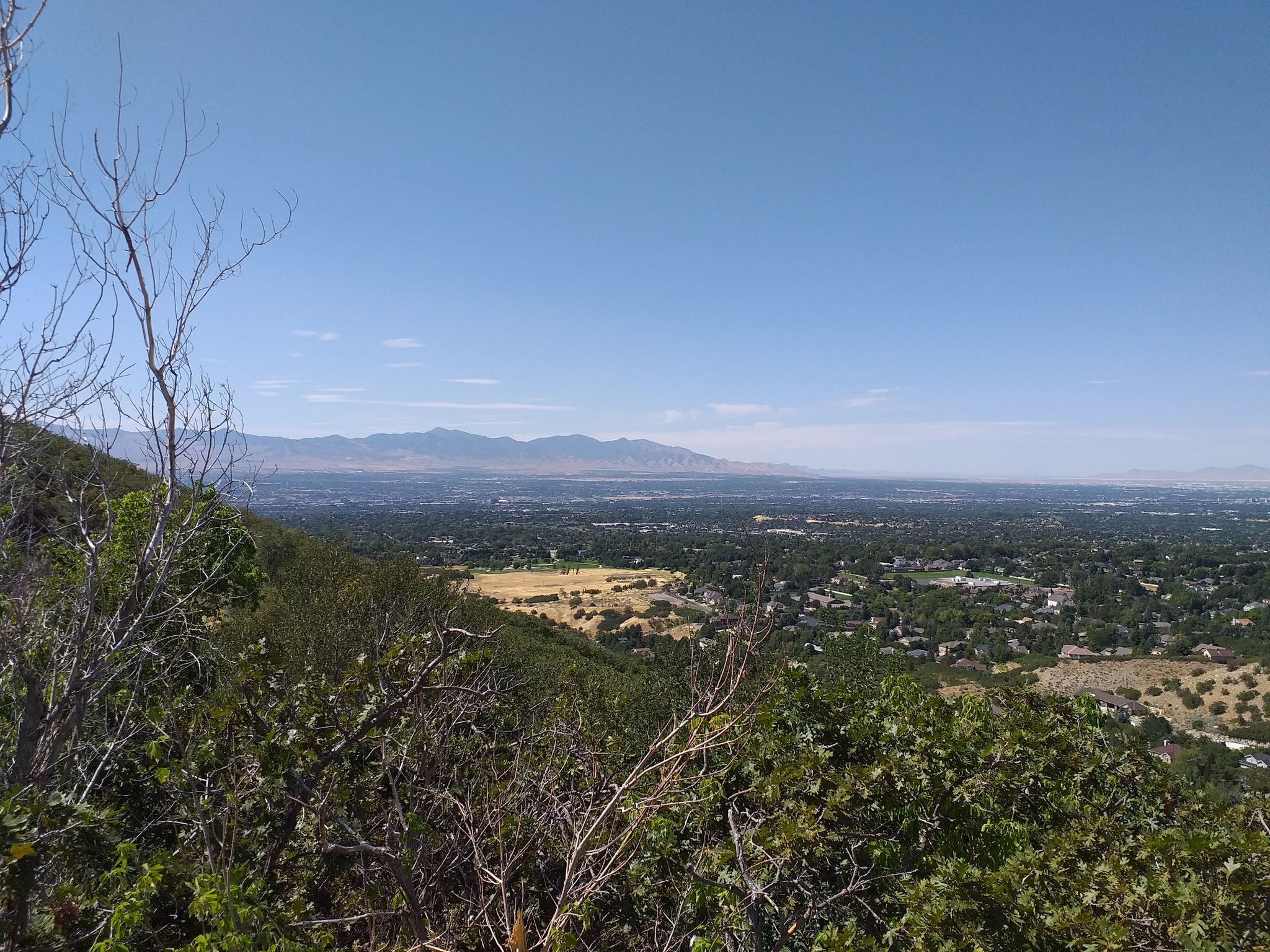 Expansive view of a valley with fields and houses under a clear blue sky. - Bells Canyon Granite Trailhead – Bells Canyon Reservoir loop from Granite