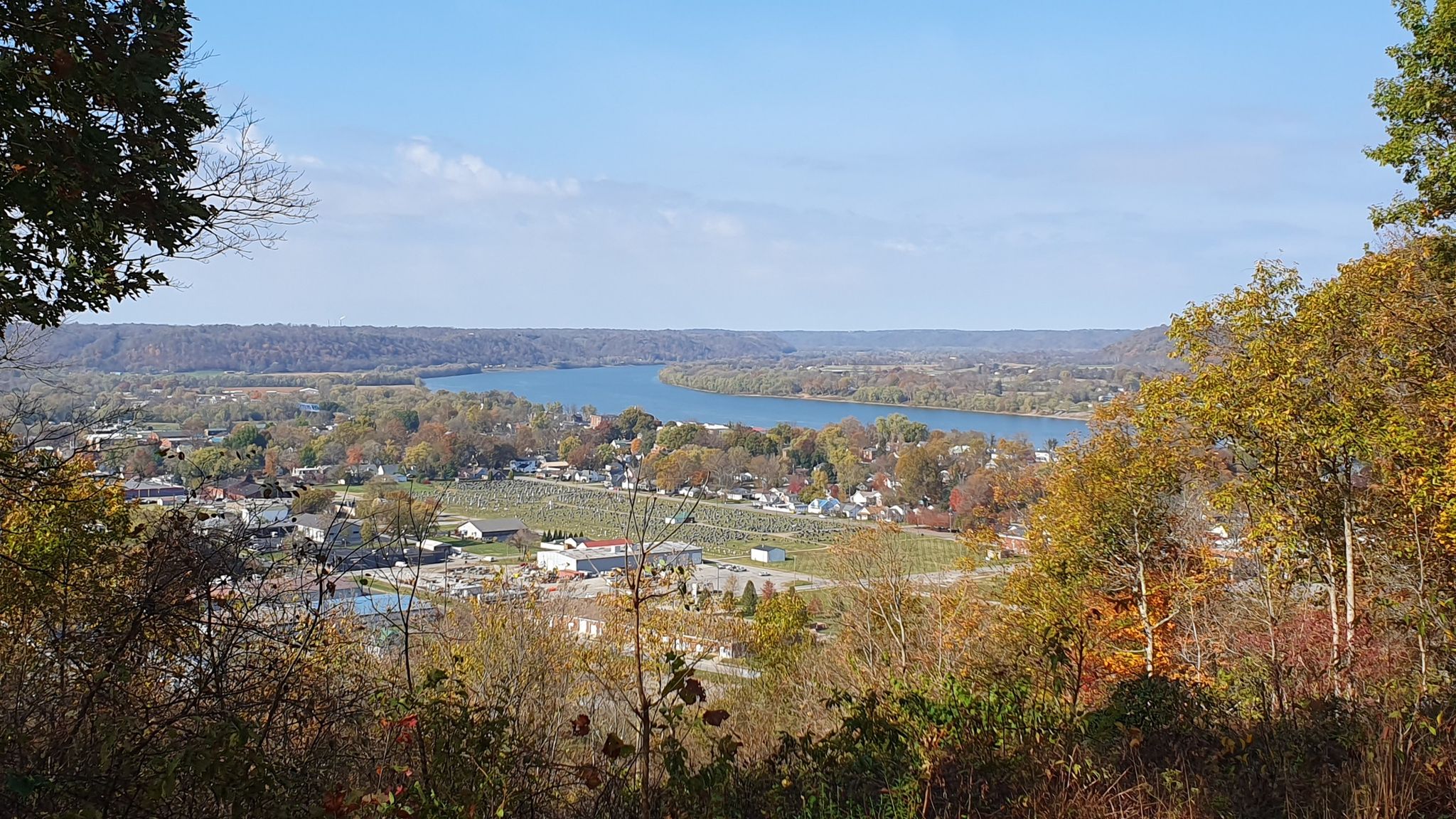 Panoramic view of a wide river, town, and autumn hills under a clear sky. - Butler Turpin House and Overlook Fossil Trail Loop