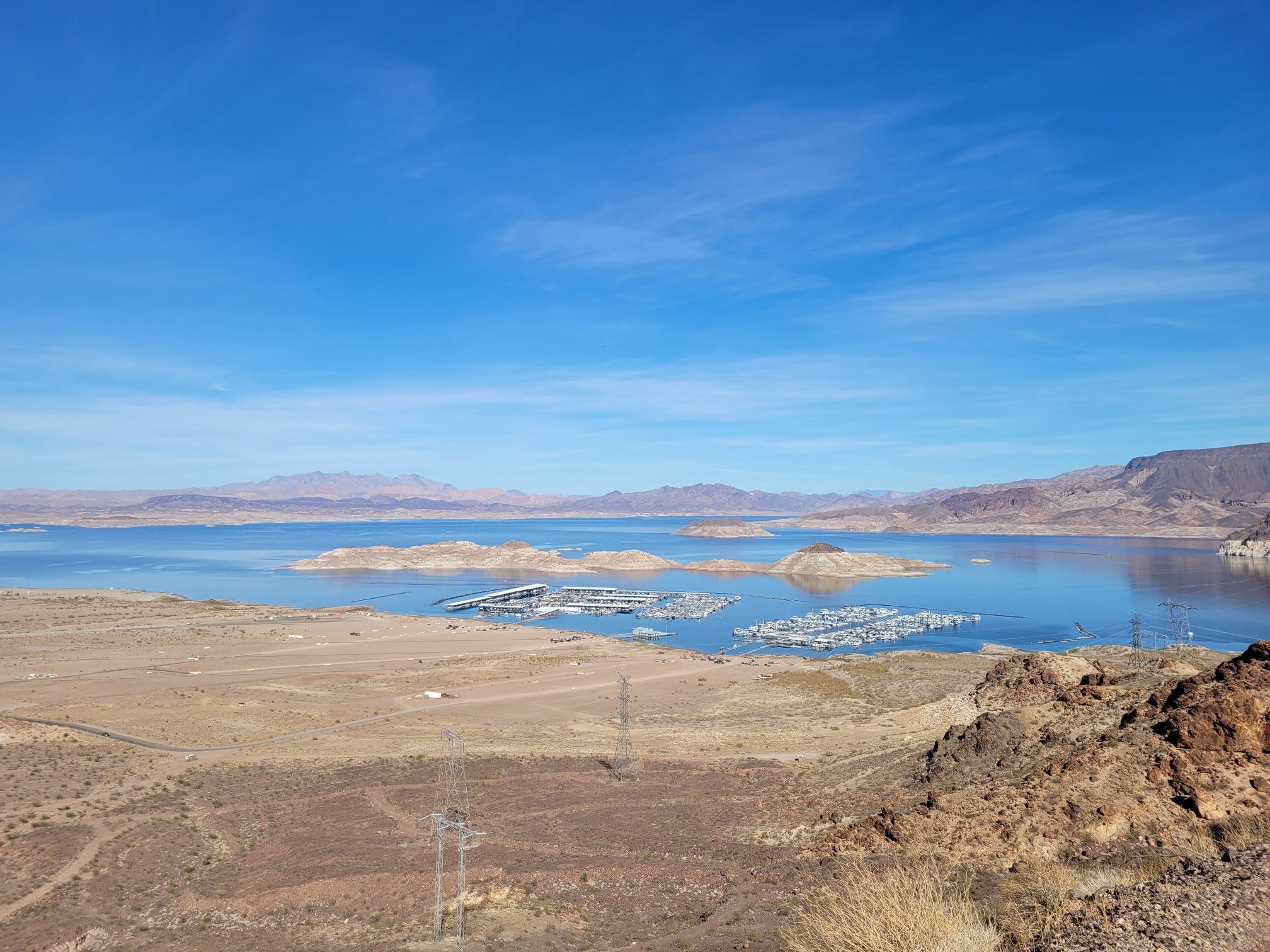 Panoramic view of a vast lake, marina, and desert landscape under clear blue sky. - Historical Railroad Tunnels – Railroad Tunnel Trail loop from Historic Railroad Trailhead Parking Lot