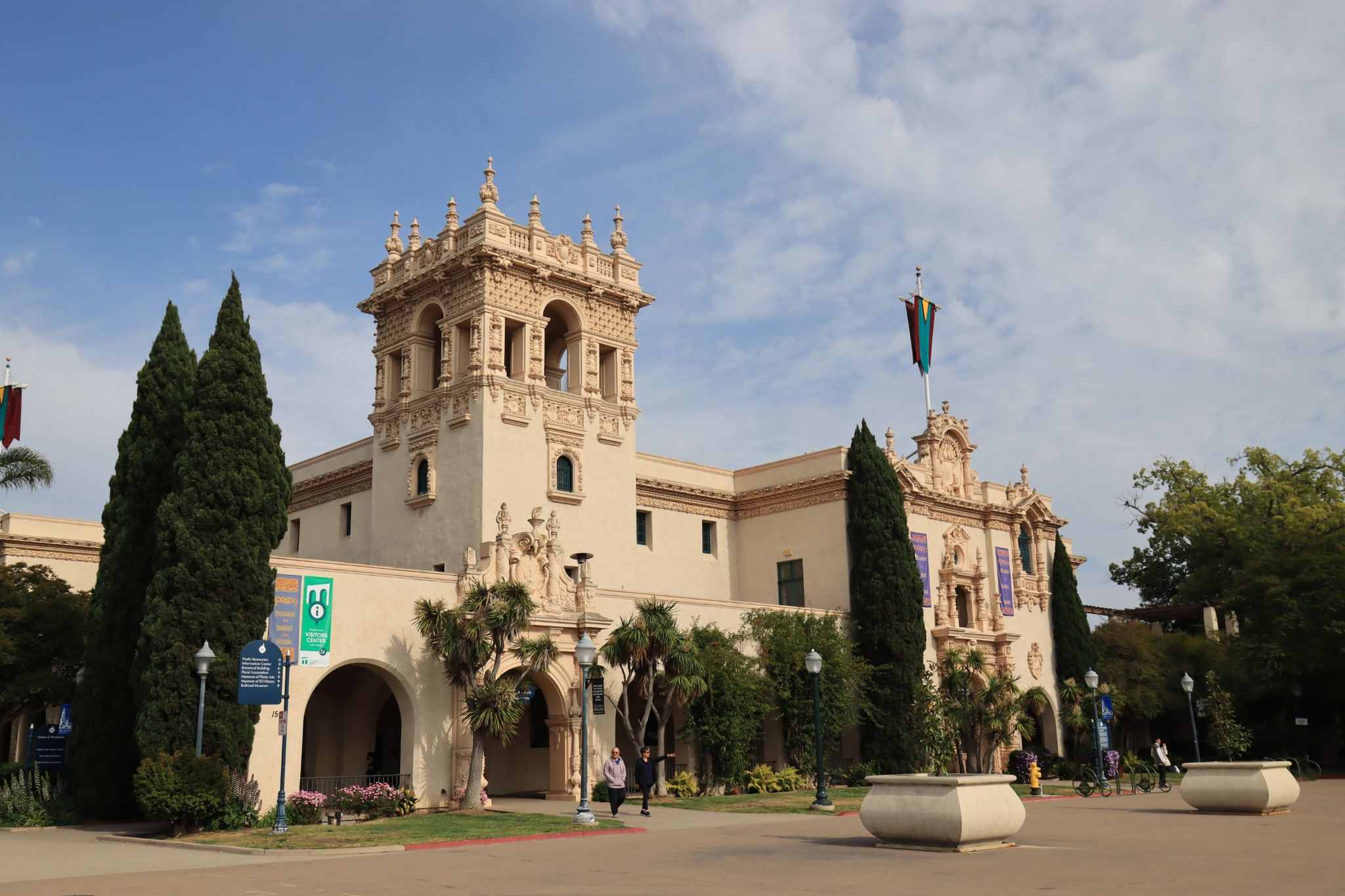Grand, ornate building with a tower, arches, and tall trees. - Panama Plaza, Balboa Park – San Diego Zoo loop from San Diego