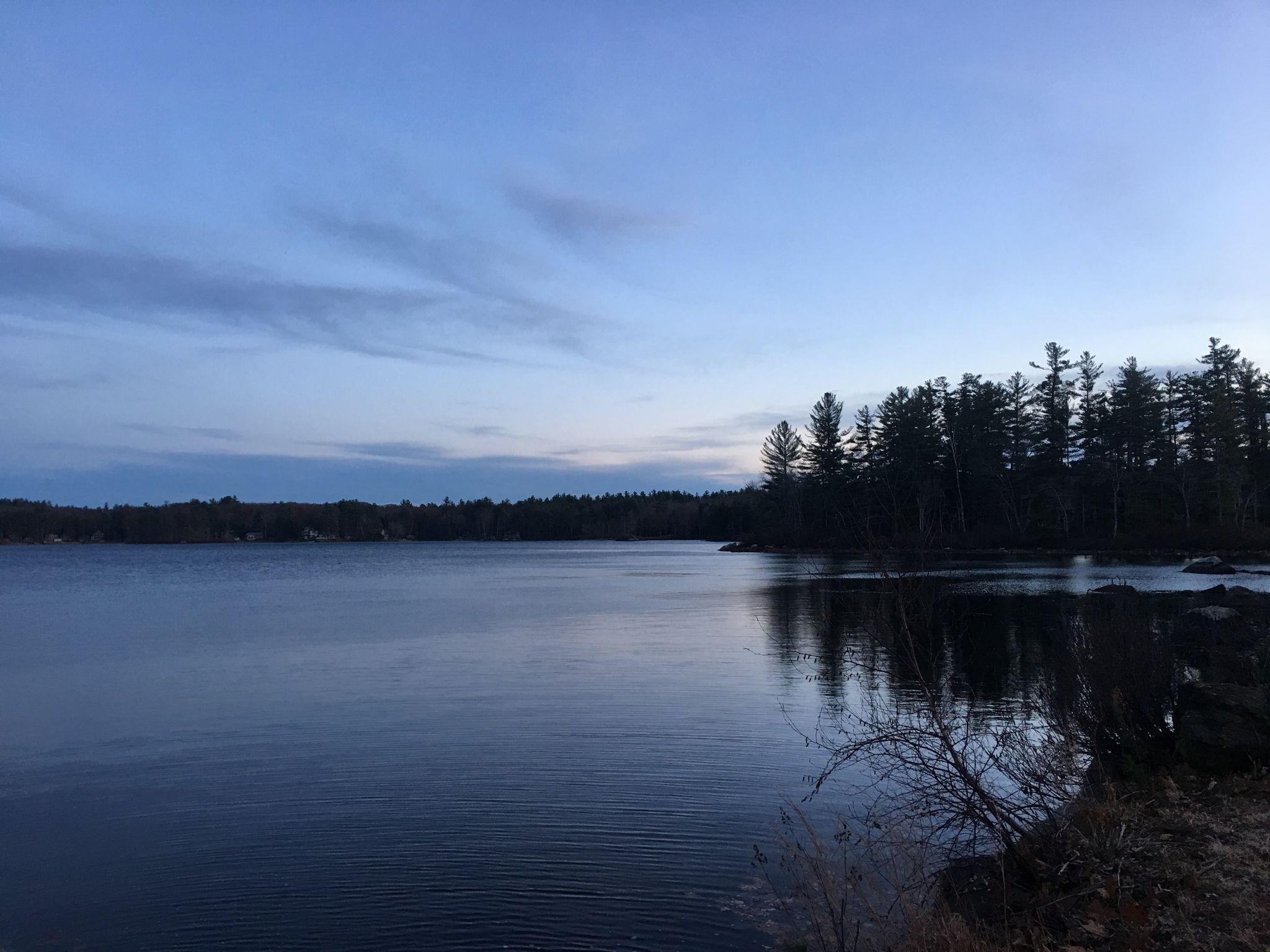 Dark lake surrounded by trees under a cloudy, twilight sky. - Swains Lake – Swains Lake loop from Toy Tech