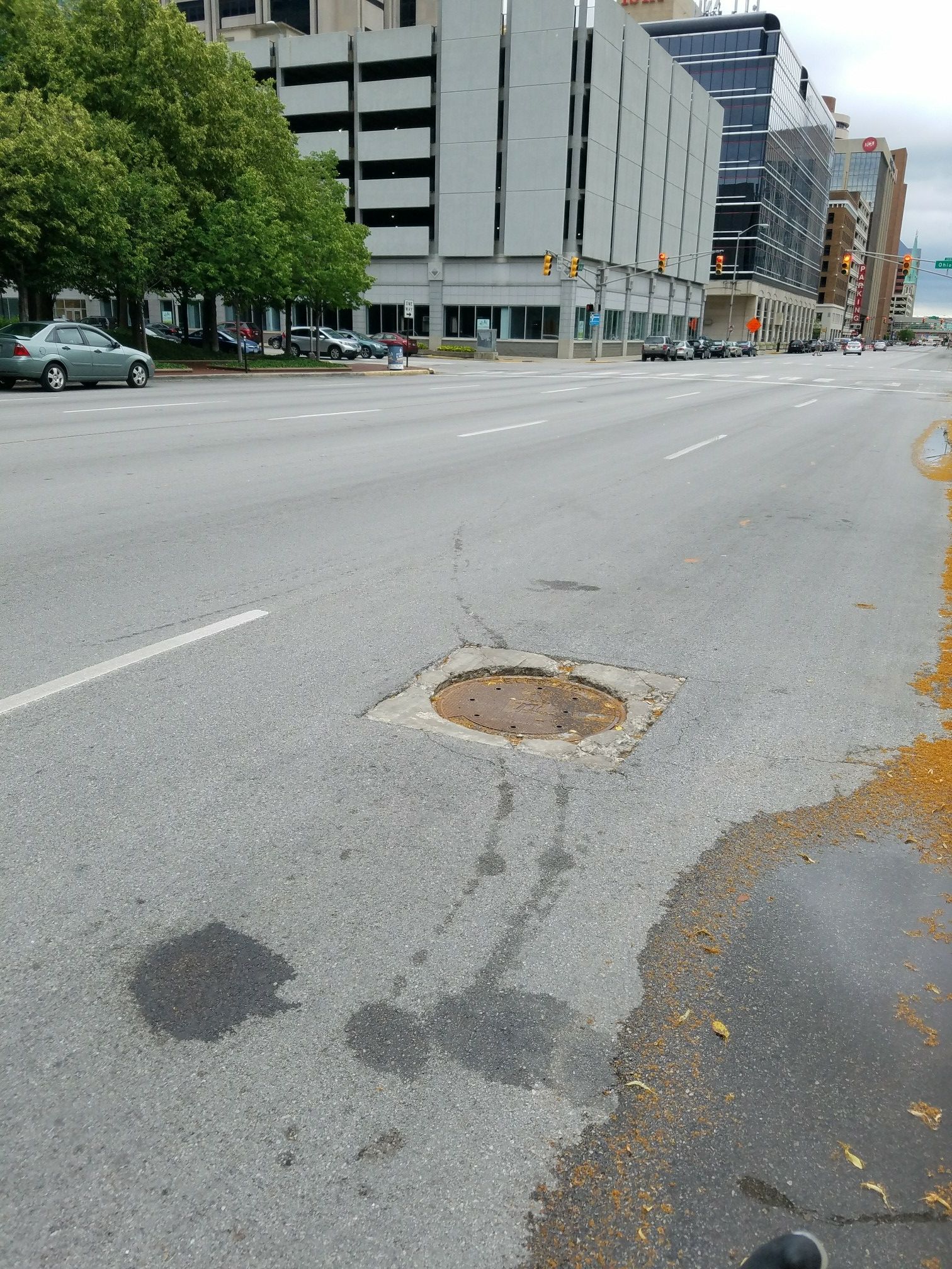 sunken manhole on Capitol Ave south of New York St