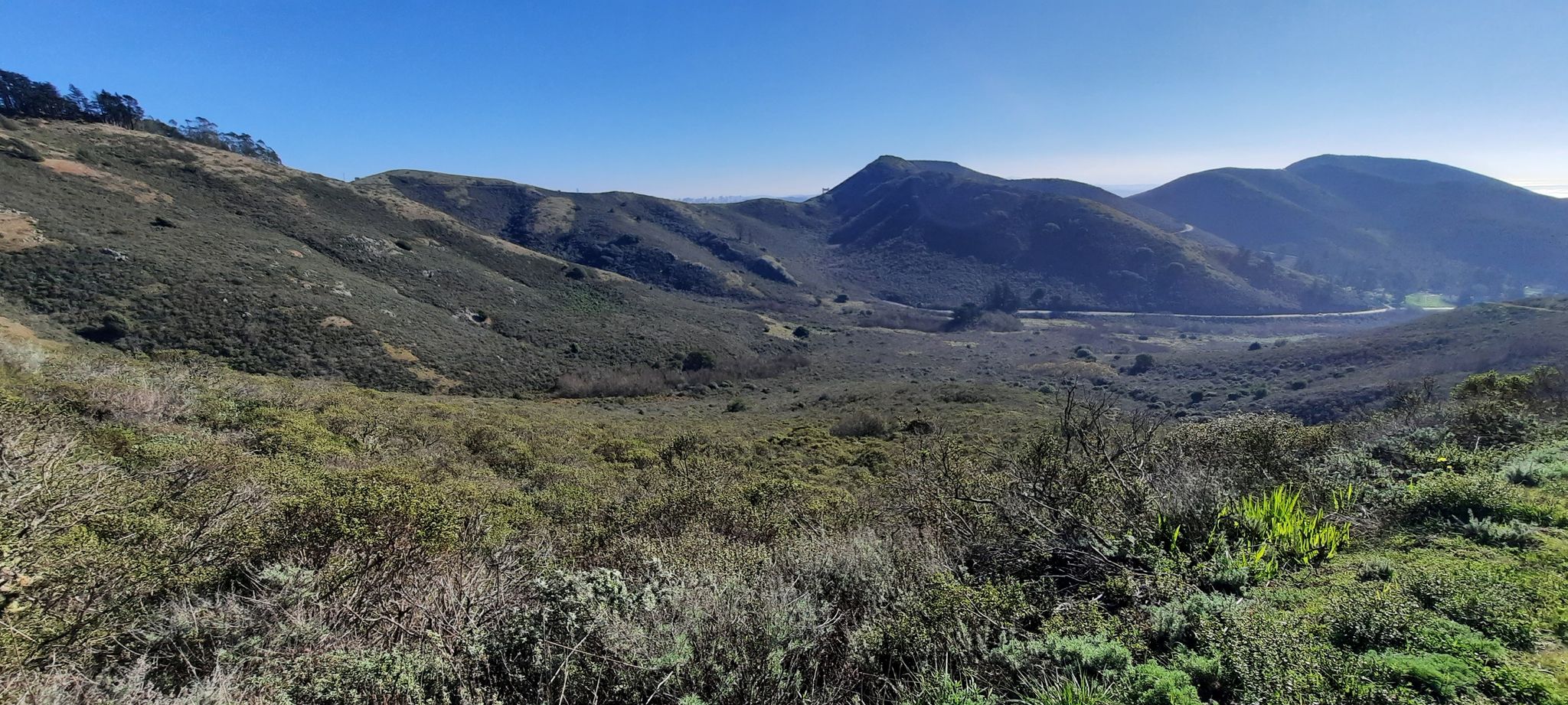 Panoramic view of a vast valley with green and brown rolling hills. - Bobcat, Alta and Rodeo Valley Trail Loop