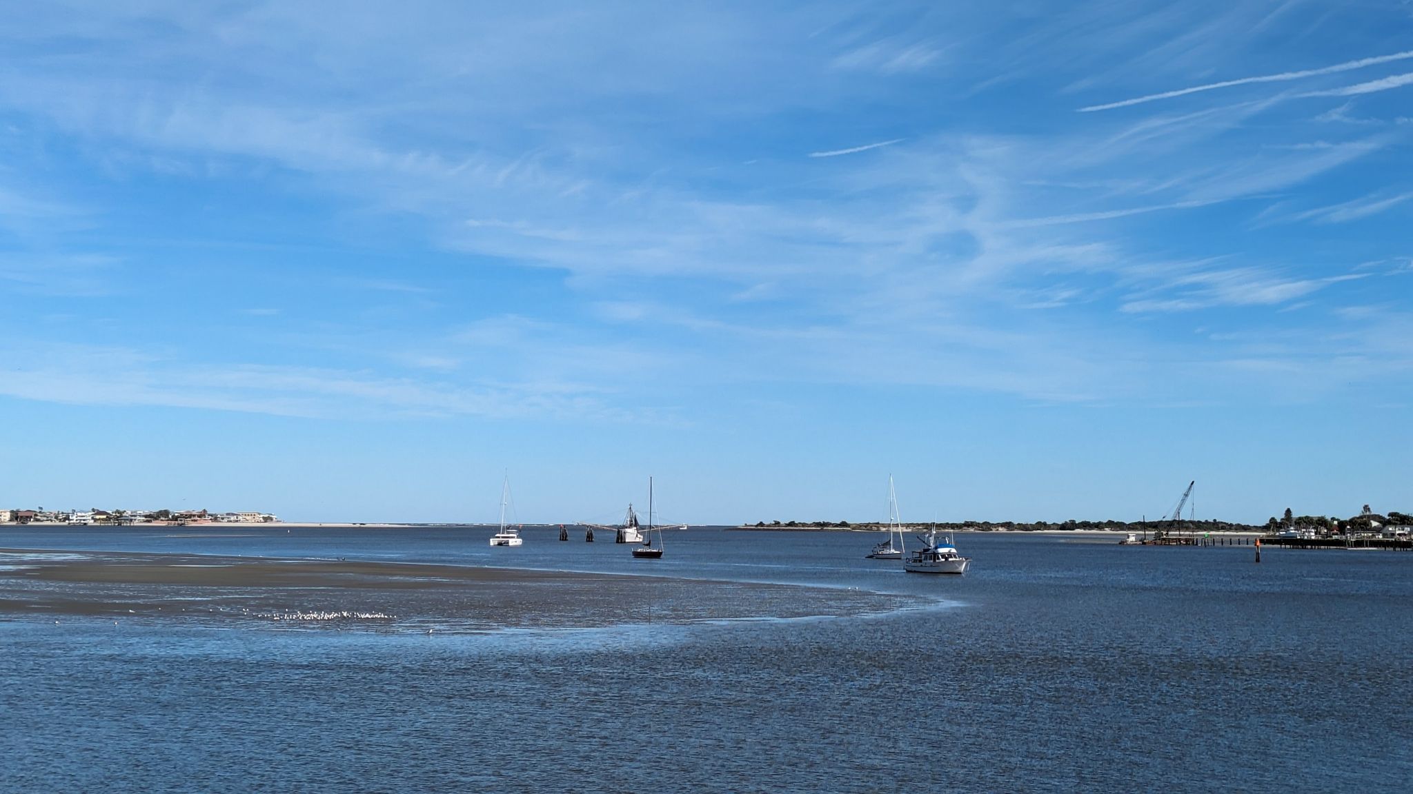 Wide bay with boats on calm water under a clear blue sky. - Vilano Beach to Castillo de San Marcos via Vilano Causeway