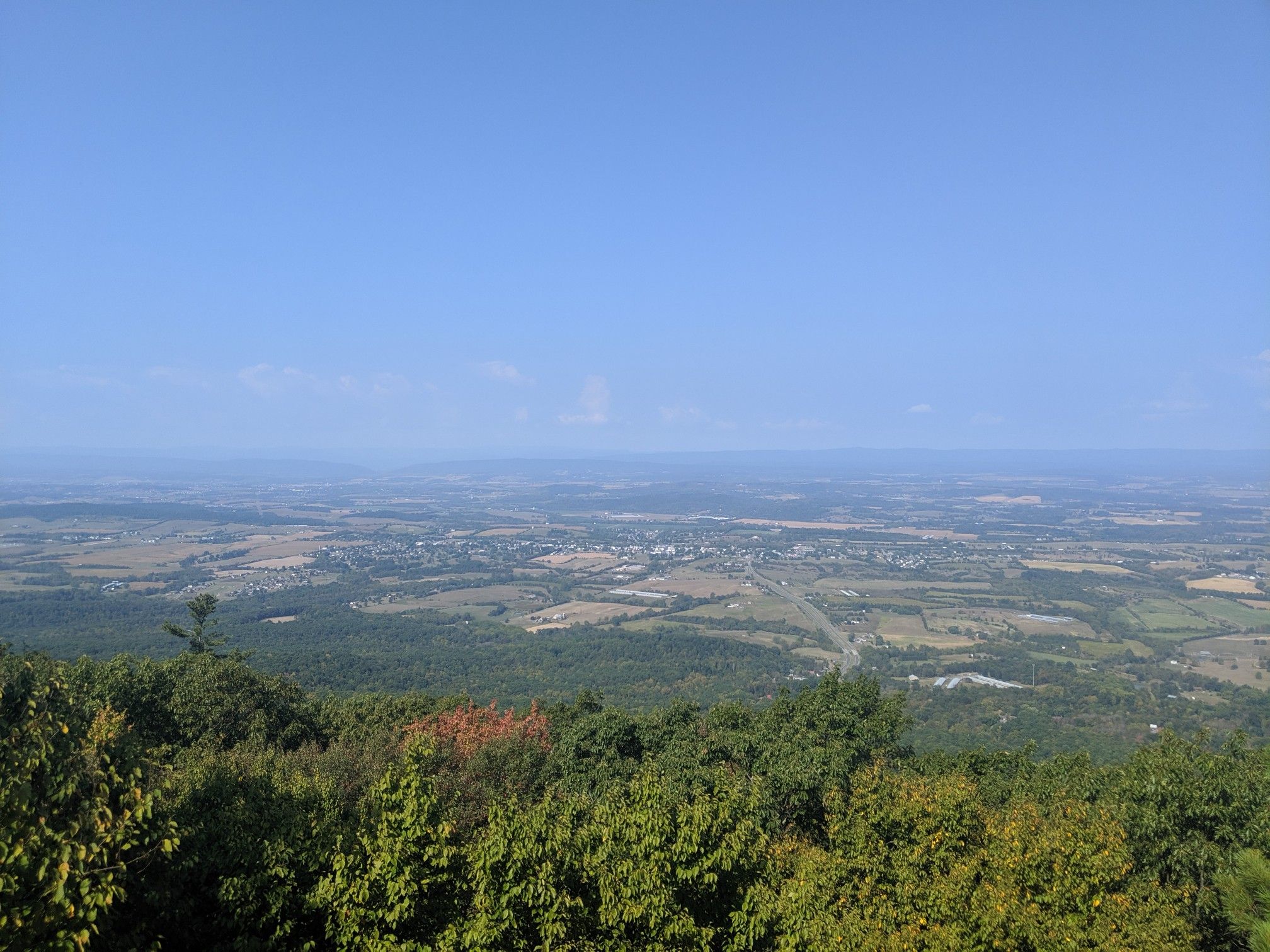 Expansive valley view from a high vantage point under a clear blue sky. - Bird Knob loop from New Market Gap