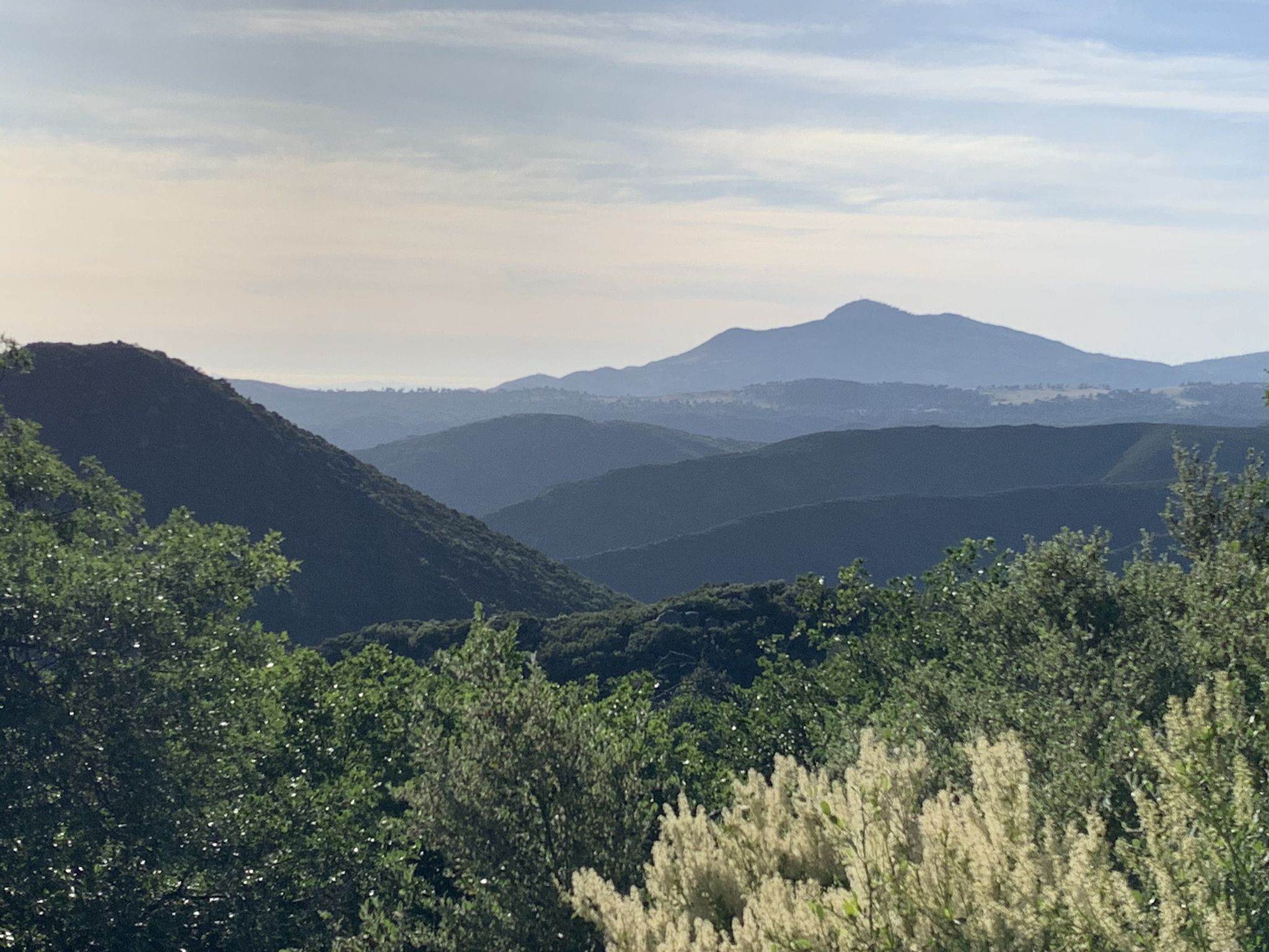Hazy layers of distant mountains and forested hills under a soft sky. - Big Laguna Lake via Sunset Trail