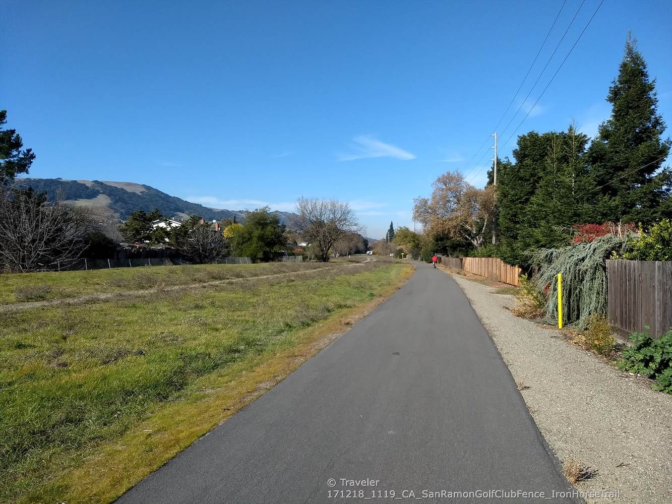 Long paved path alongside a grassy field under a clear blue sky. - San Ramon iron horse trail – Iron Horse Trail loop from San Ramon