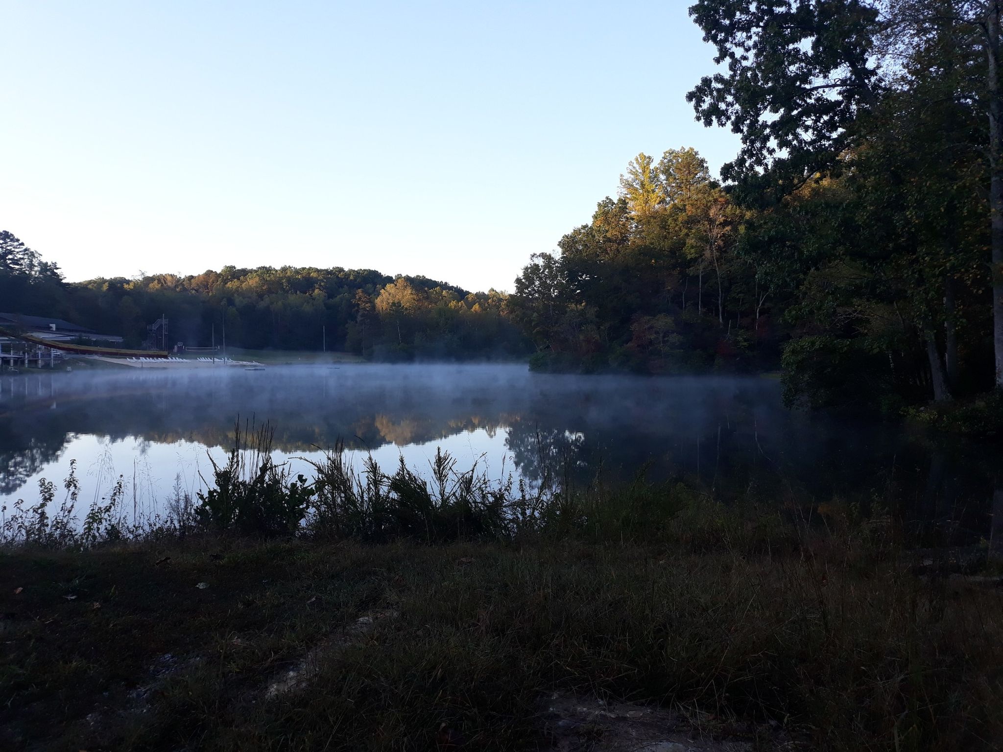 Misty lake reflecting trees under a clear morning sky. - Lake Hydaway Dam loop from Liberty University