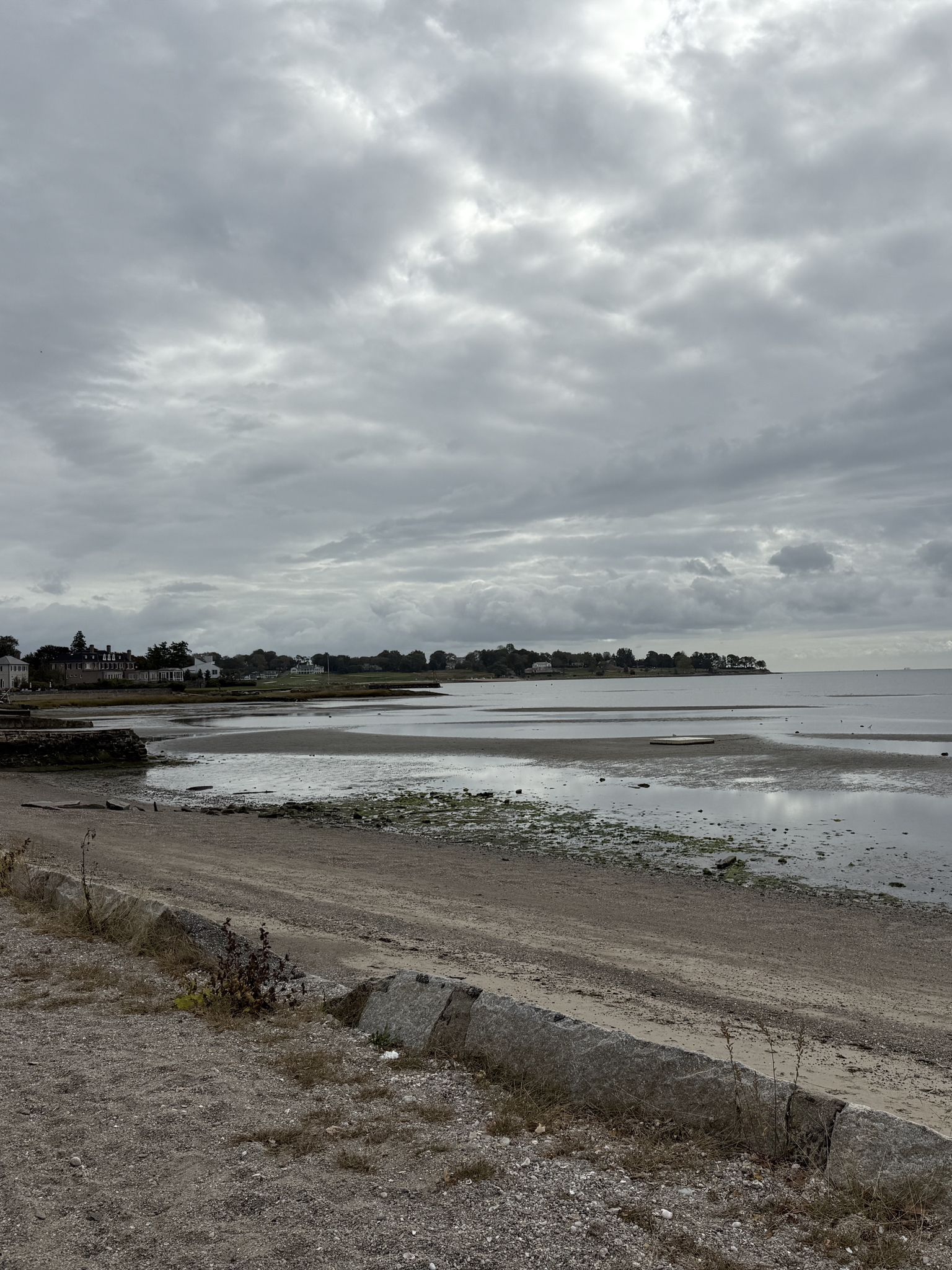 Overcast sky above a calm beach with distant buildings and low tide. - Harbor Road - quiet and pretty neighborhood – Pequot Avenue (brand new surface) loop from East Norwalk