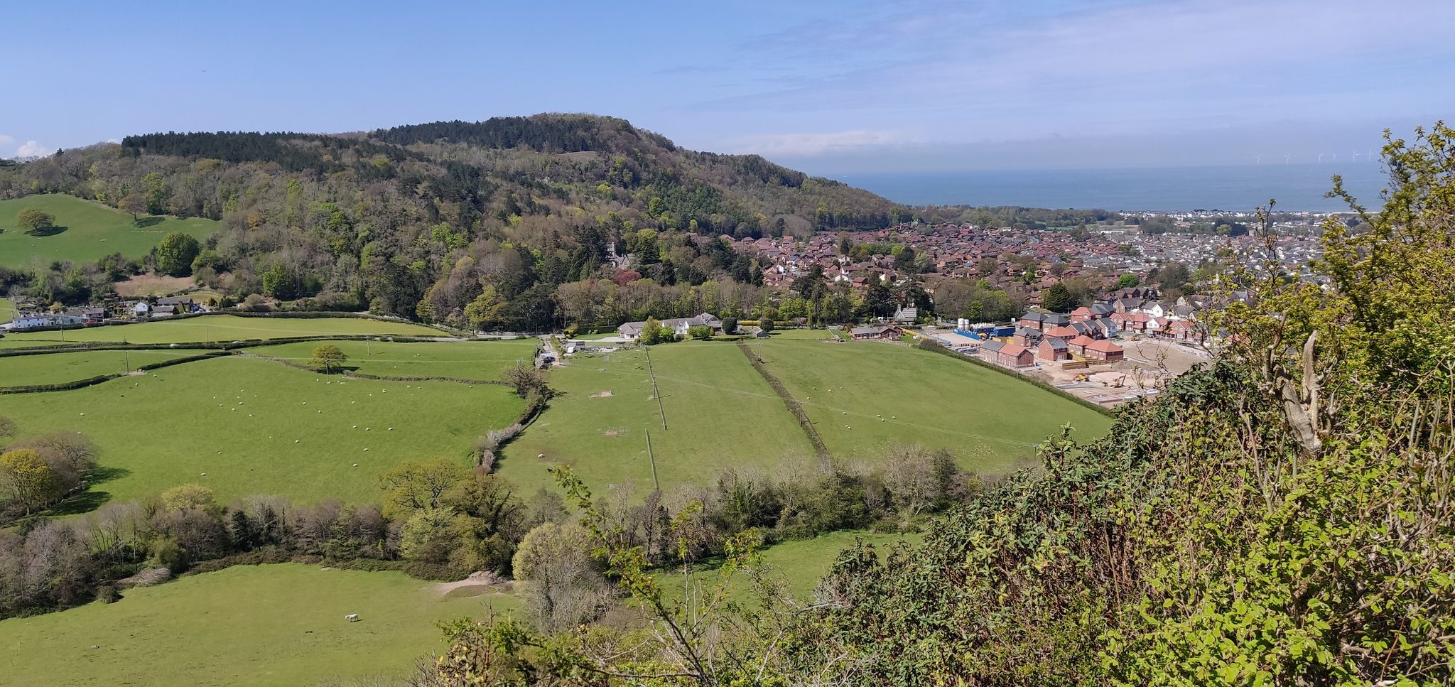 Viewpoint over Abergele. 2 x benches facing West