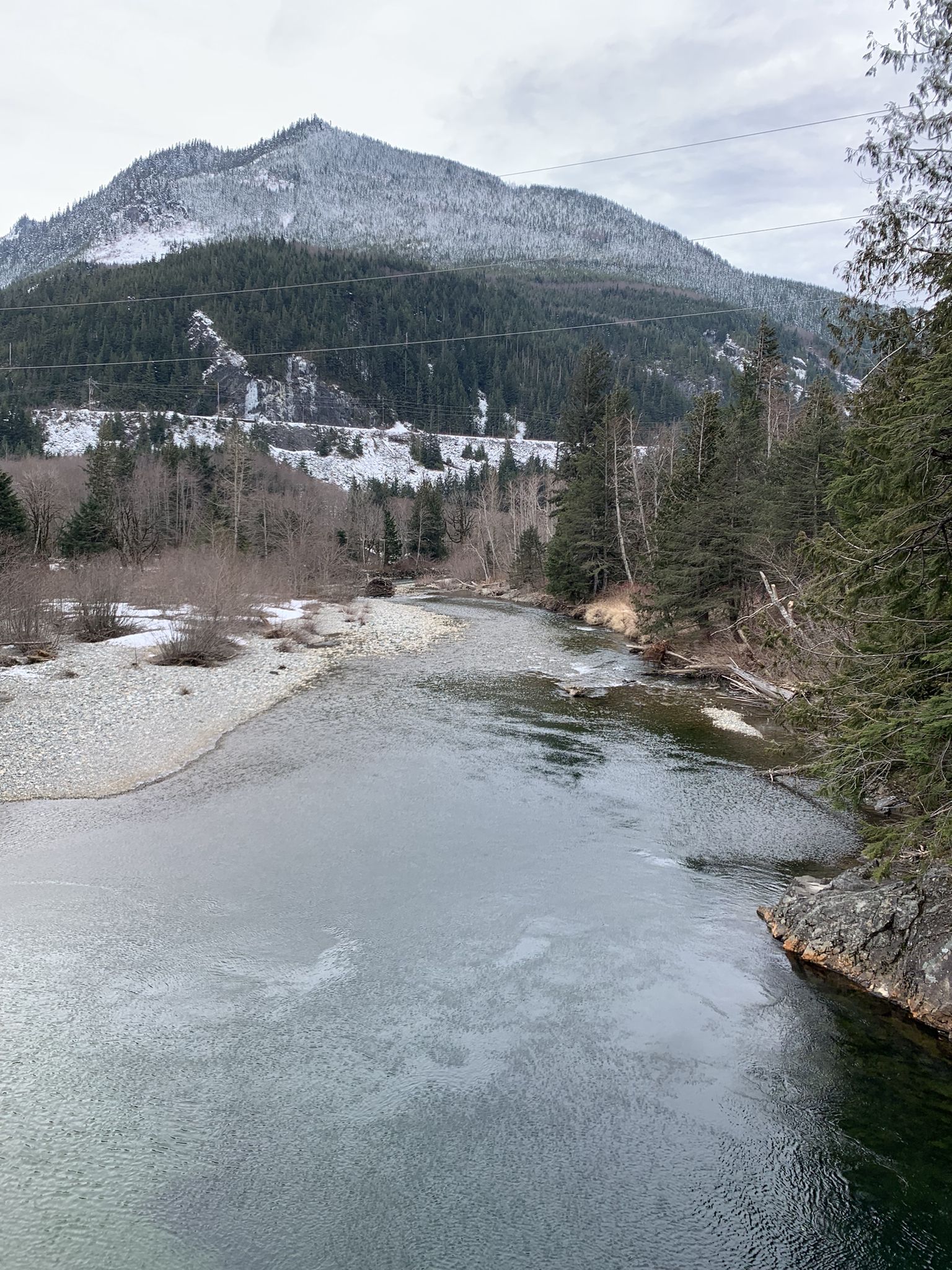 River flowing through a valley with snow-capped mountains under a cloudy sky. - Dirty Harry's Balcony – Dirty Harry's Balcony loop from Olallie State Park South Fork Fishing Access