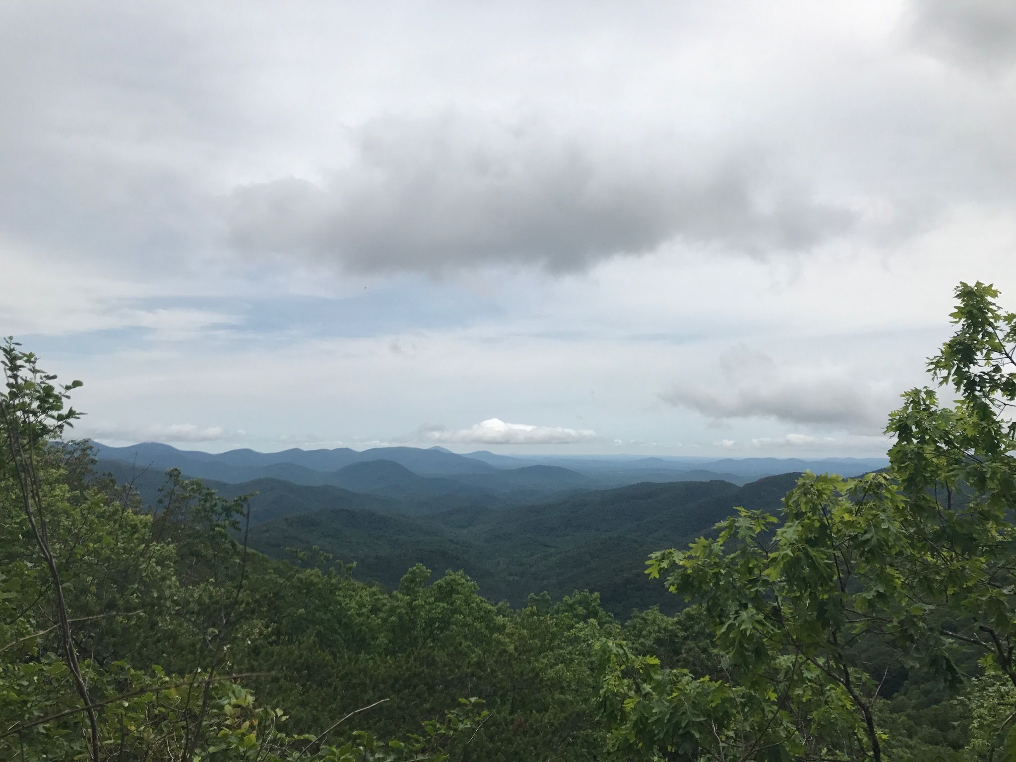 Panoramic view of green mountains under a cloudy sky. - Lake Winfield Scott – Woody Gap loop from Wolfpen Stamp
