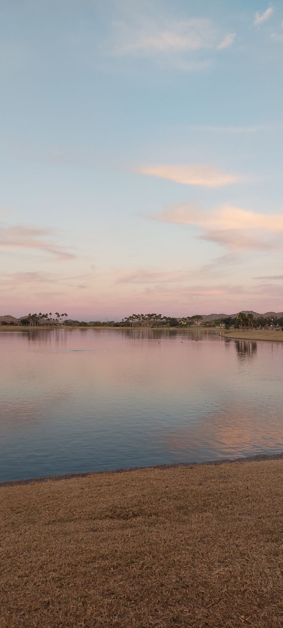 Calm lake reflecting a beautiful pink and blue sunset sky. - North Lake loop from FINS Trailhead Parking