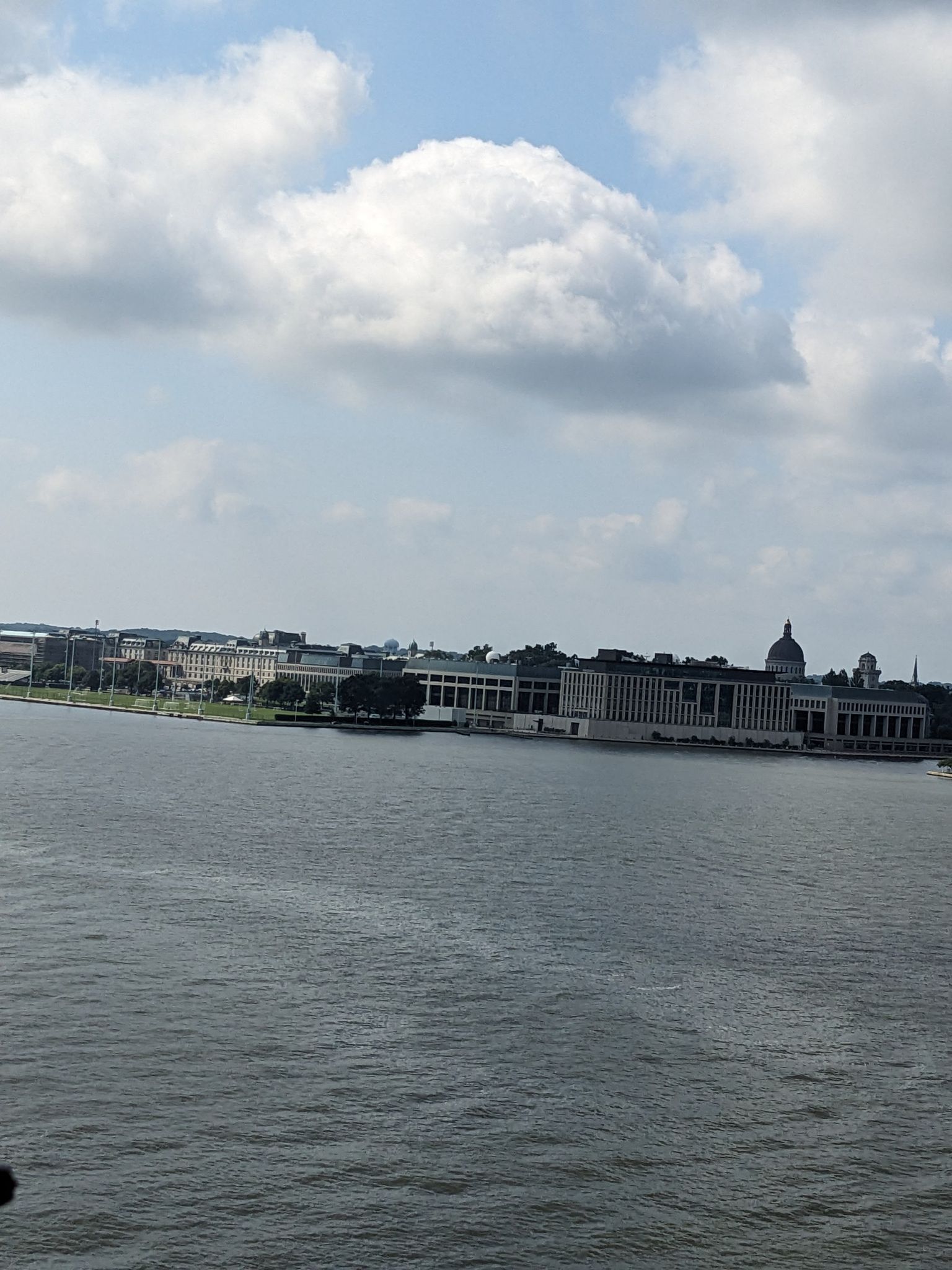 Wide body of water with large buildings on a distant shoreline. - Severn River views – Baltimore & Annapolis Trail loop from Baltimore Washington Medical Center