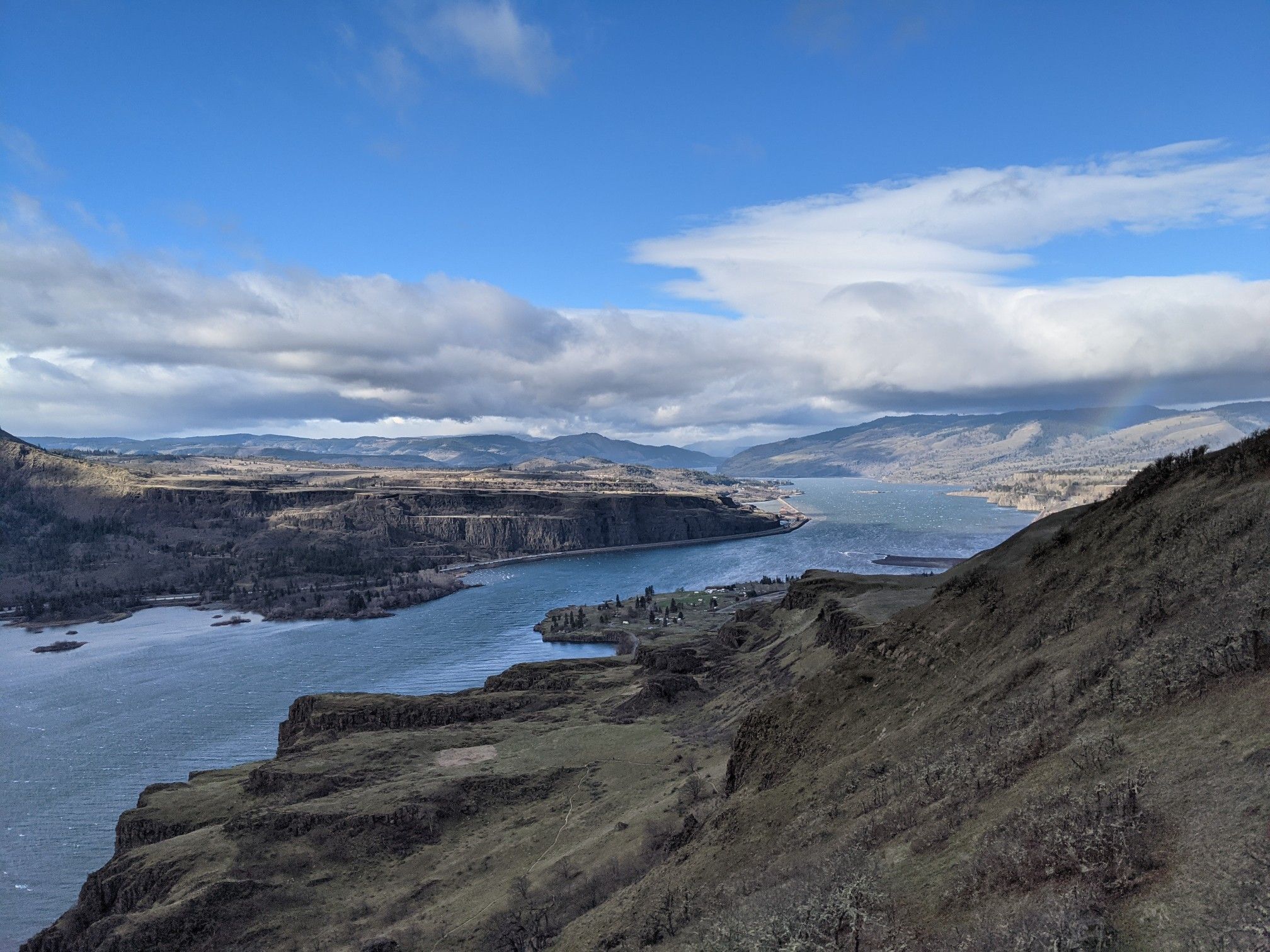 Expansive view of a wide river winding through a mountainous valley. - Lyle Cherry Orchard Trail