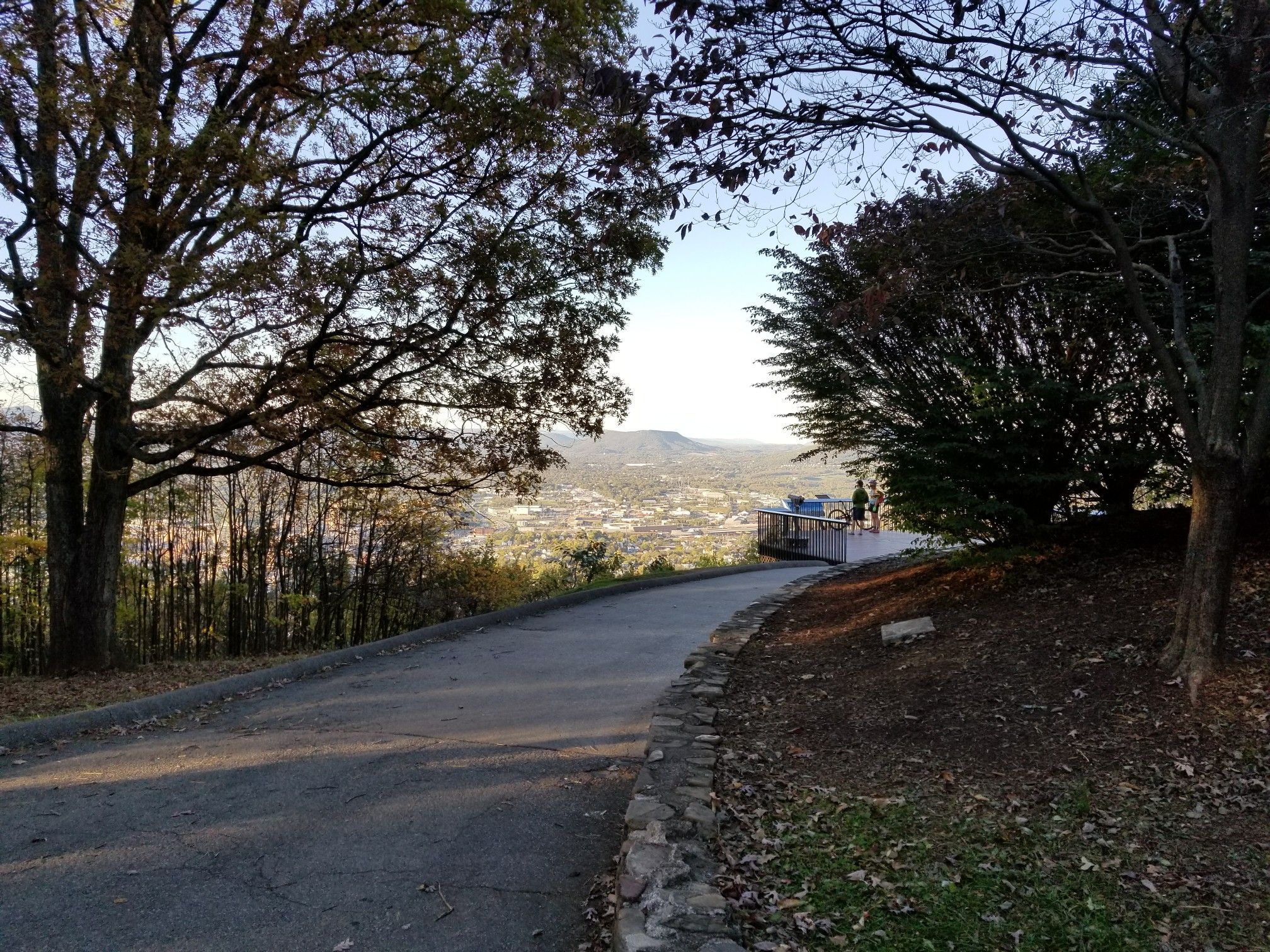 Paved path leading to an observation deck with people overlooking a city. - Roanoke Star on Mill Mountain – Roanoke City Market loop from Roanoke