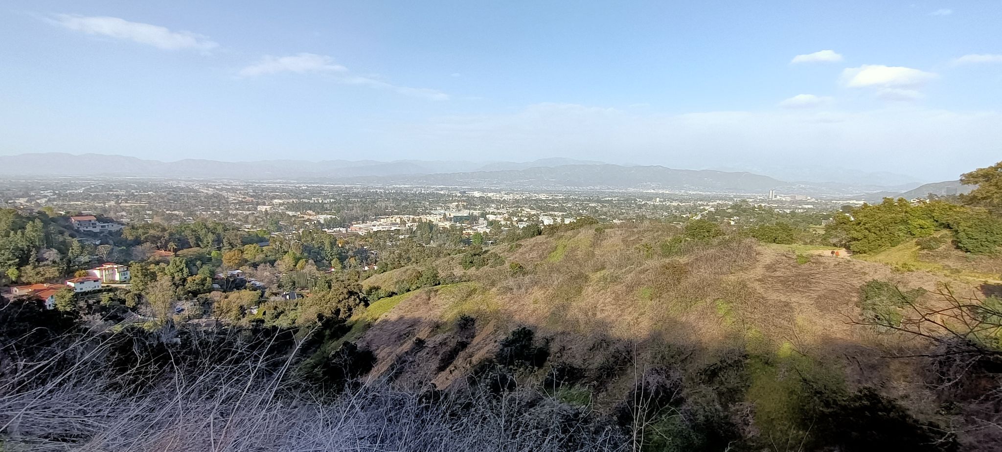 Panoramic view of a city in a valley surrounded by hills. - Betty B. Dearing Trail