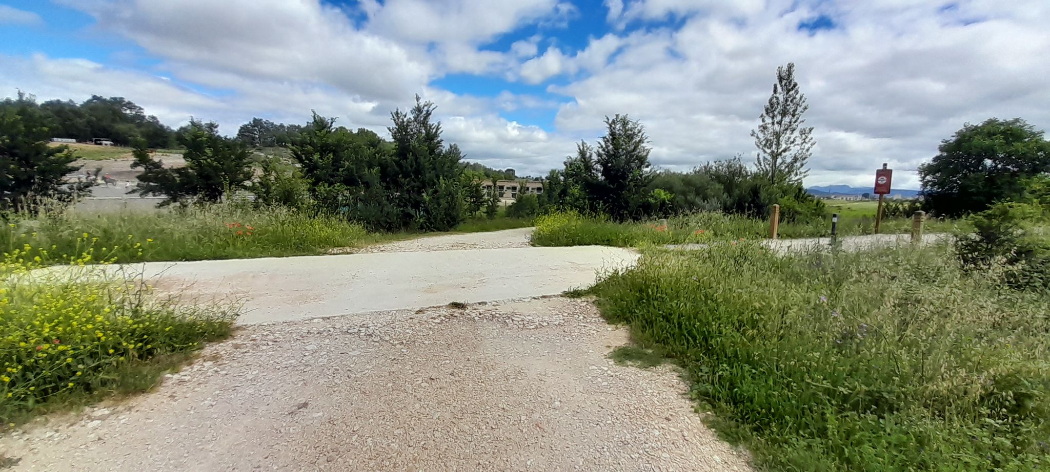 Cross the old railway before reaching a horseriding  school